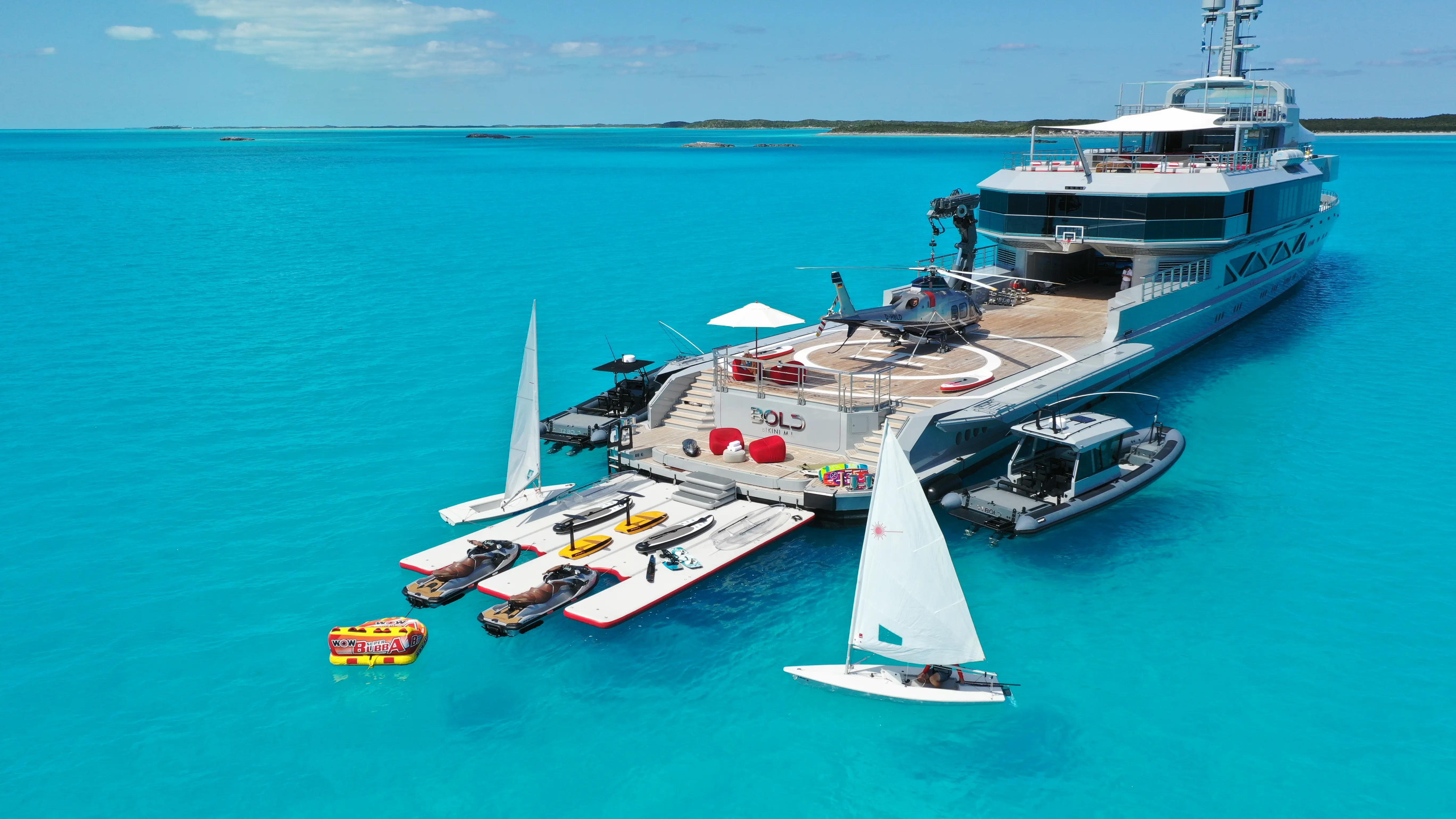 Retro teal cafe interior with orange chairs, plants.