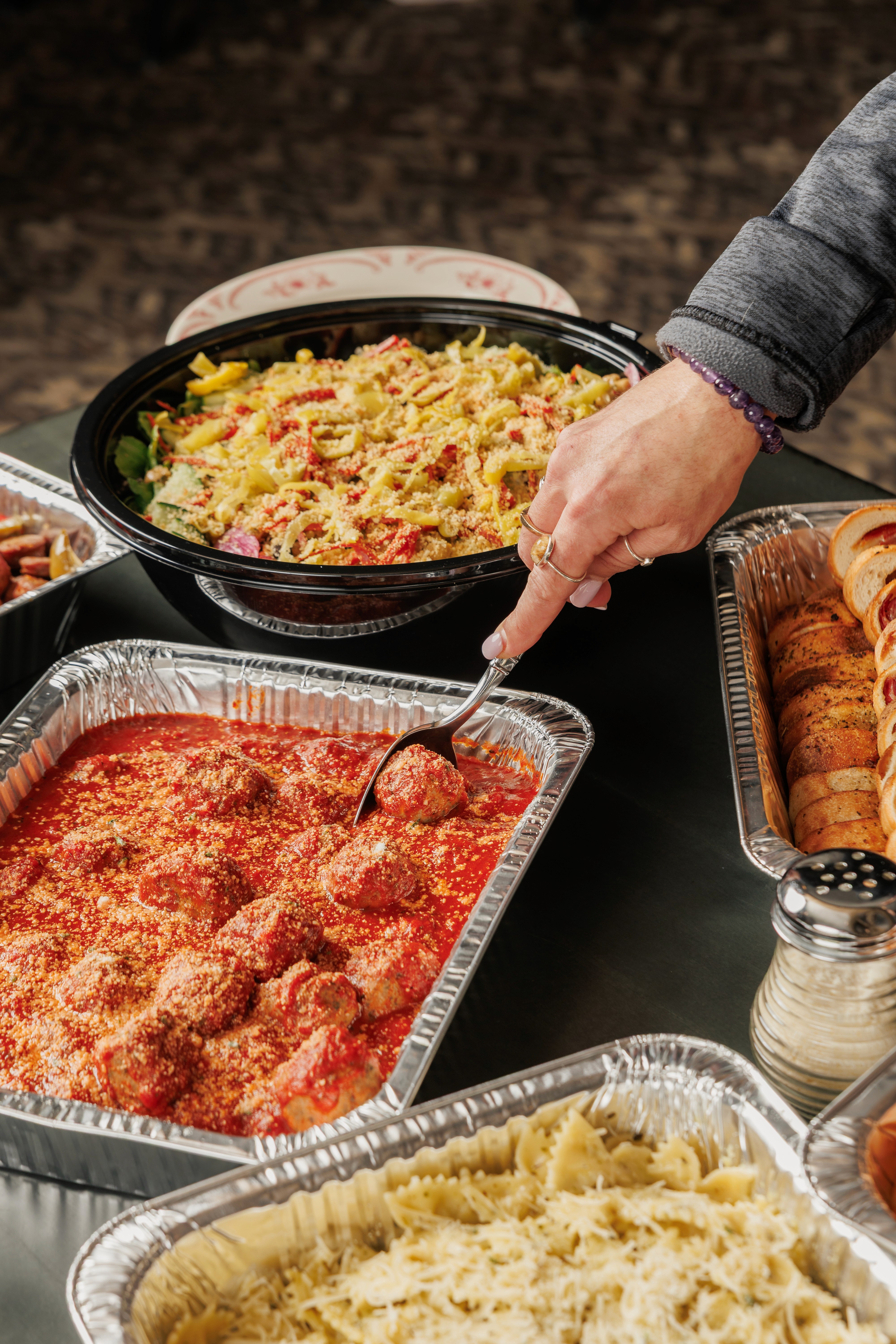 breadsticks, meatballs and salad from degidios catering