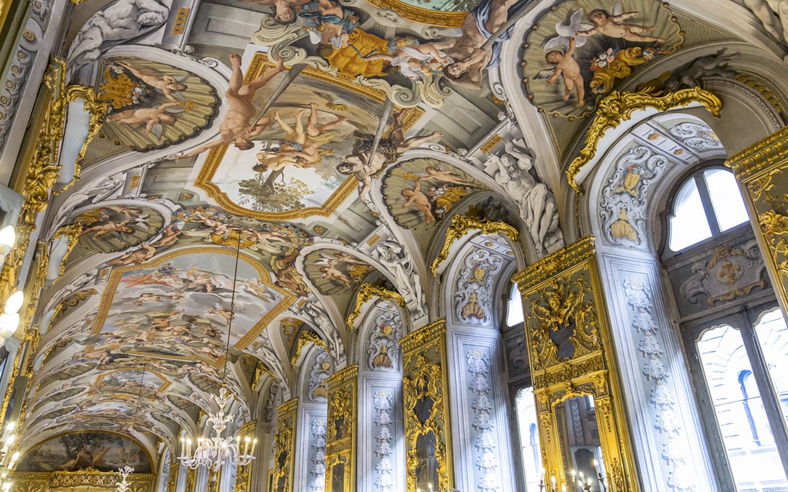Doria Pamphilj Gallery ceiling frescoes with intricate artwork and gold accents.