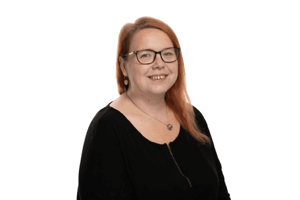 Professional headshot of a women with ginger hair.