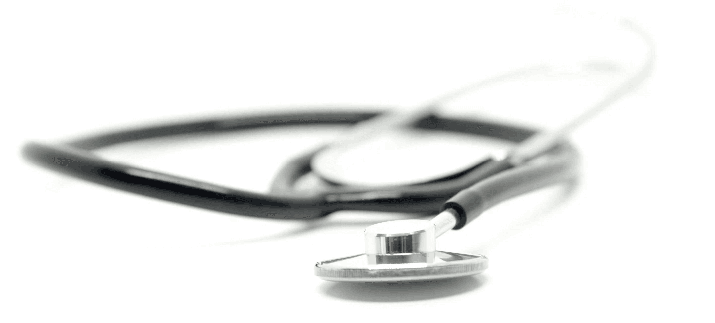 Shallow depth of field photo of a stethoscope on a white background