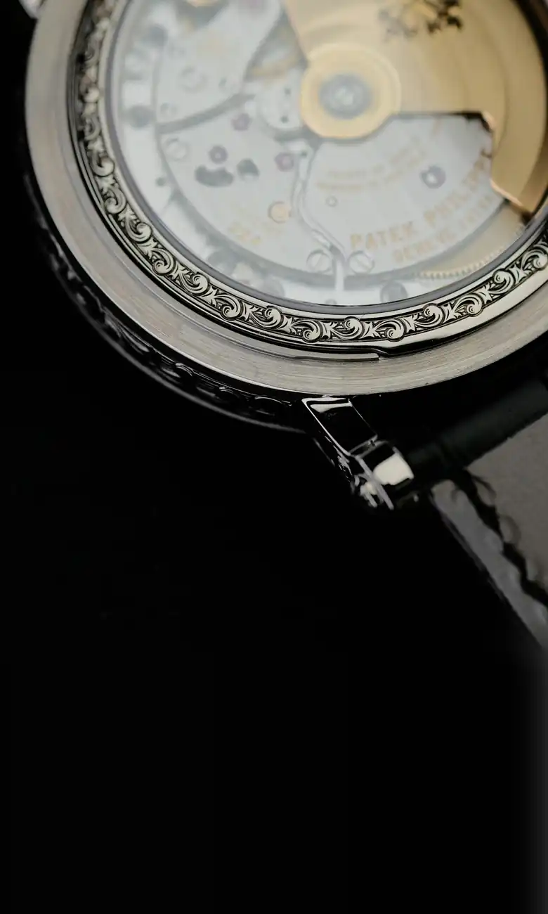 Patek Philippe movement seen through the case back of a dress watch, valued at today’s Dubai market price