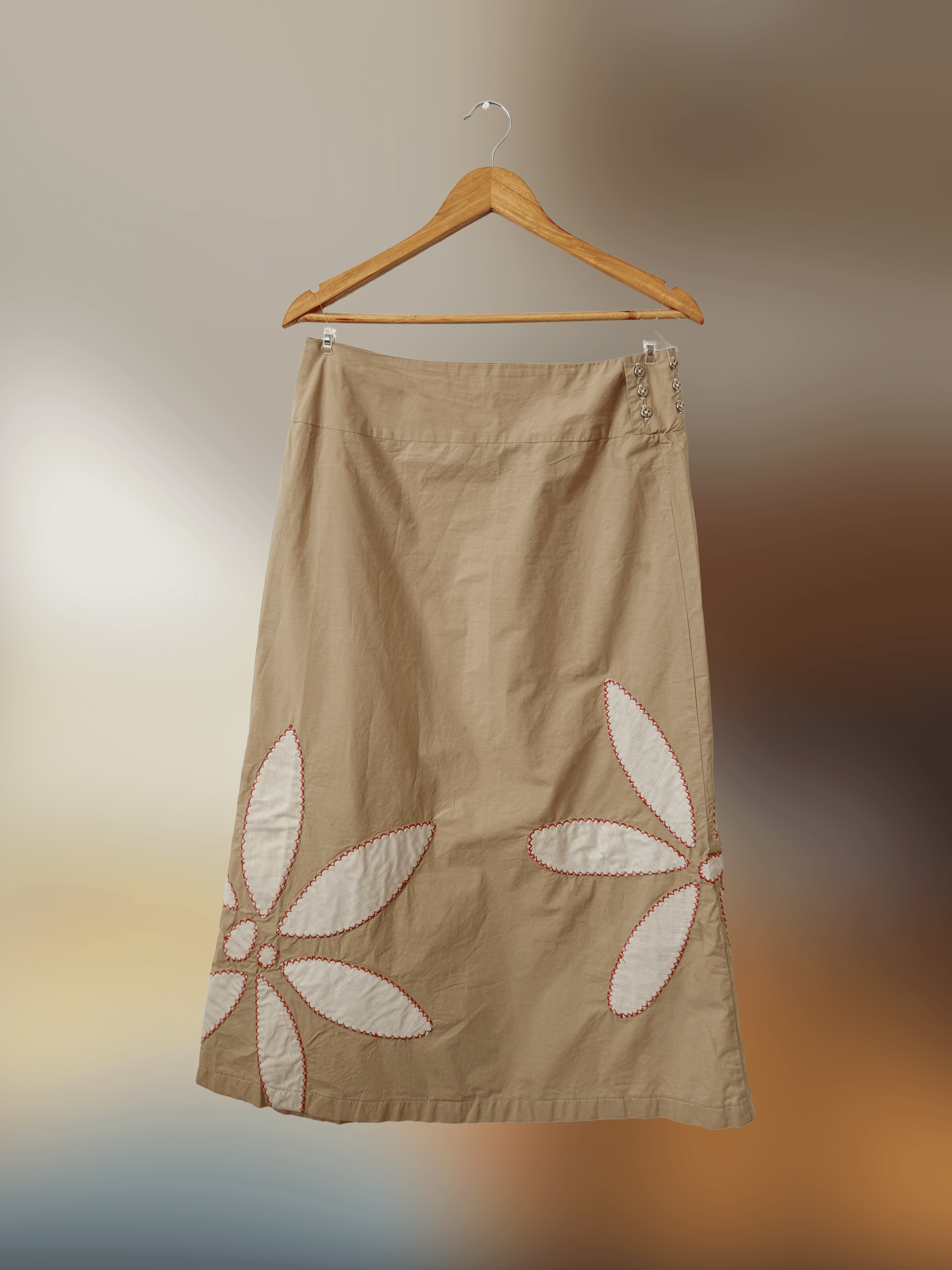 beige long skirt with some white flower petal patchwork
