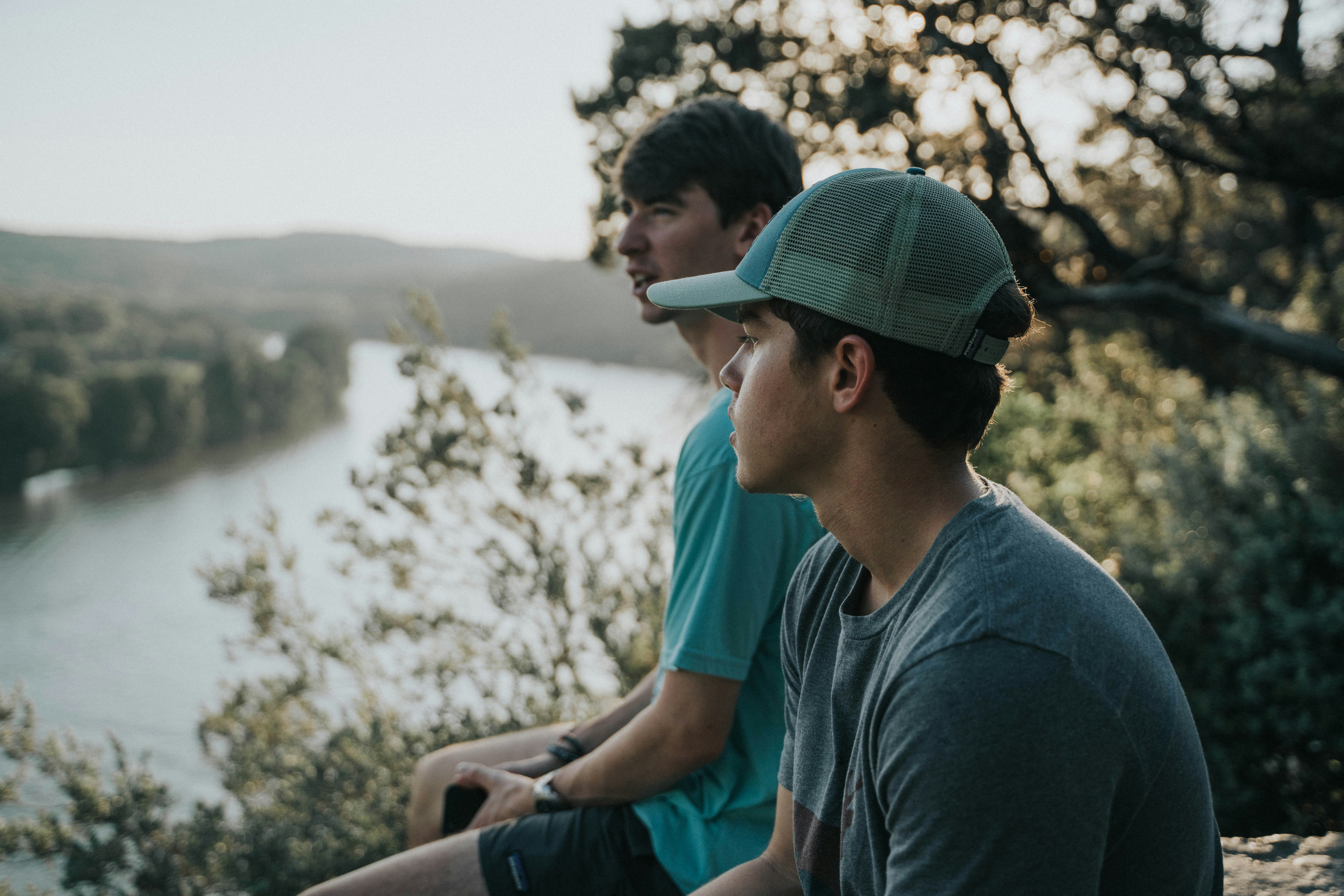man wearing green trucker cap