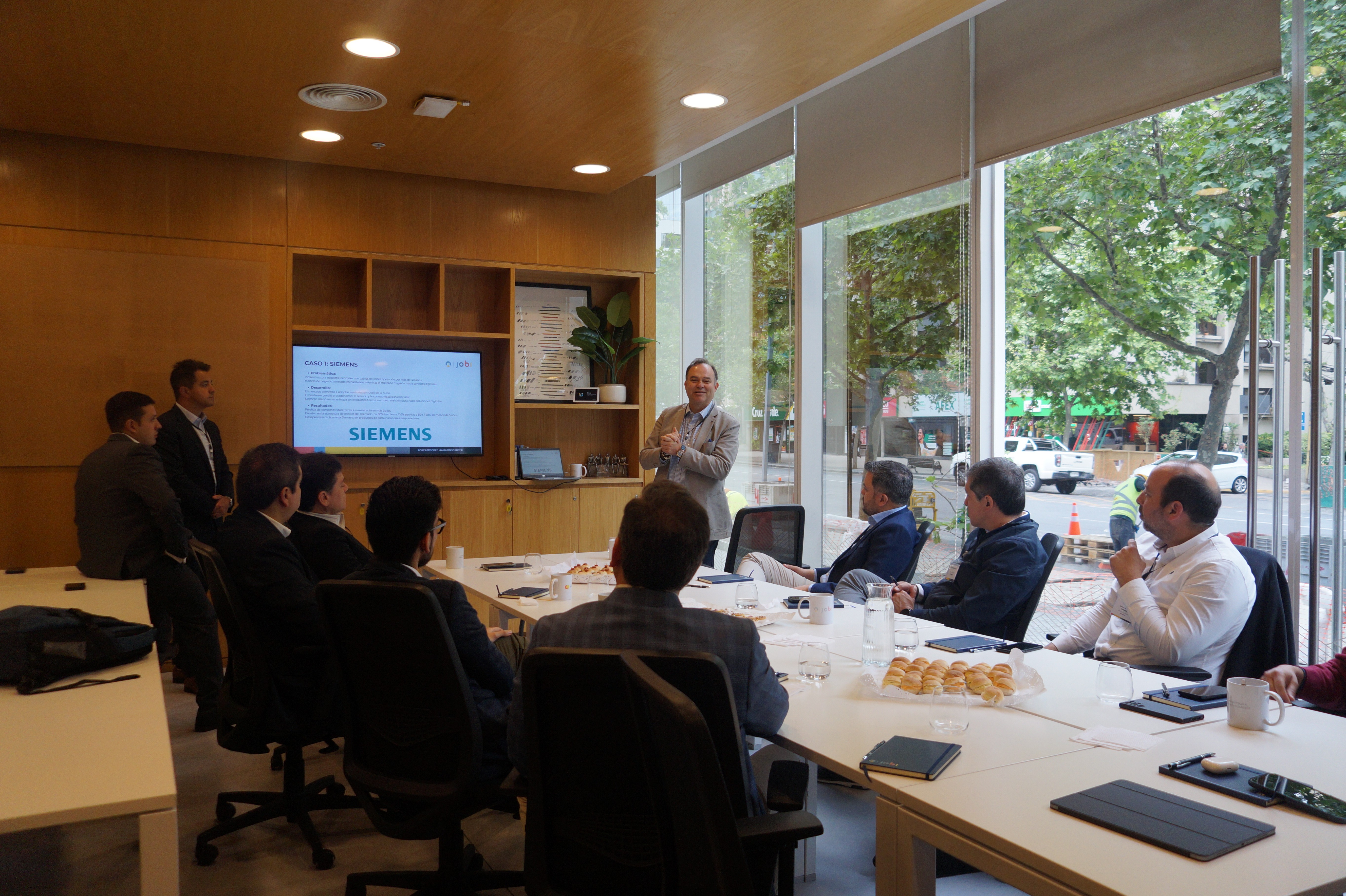 People using laptop and discusing