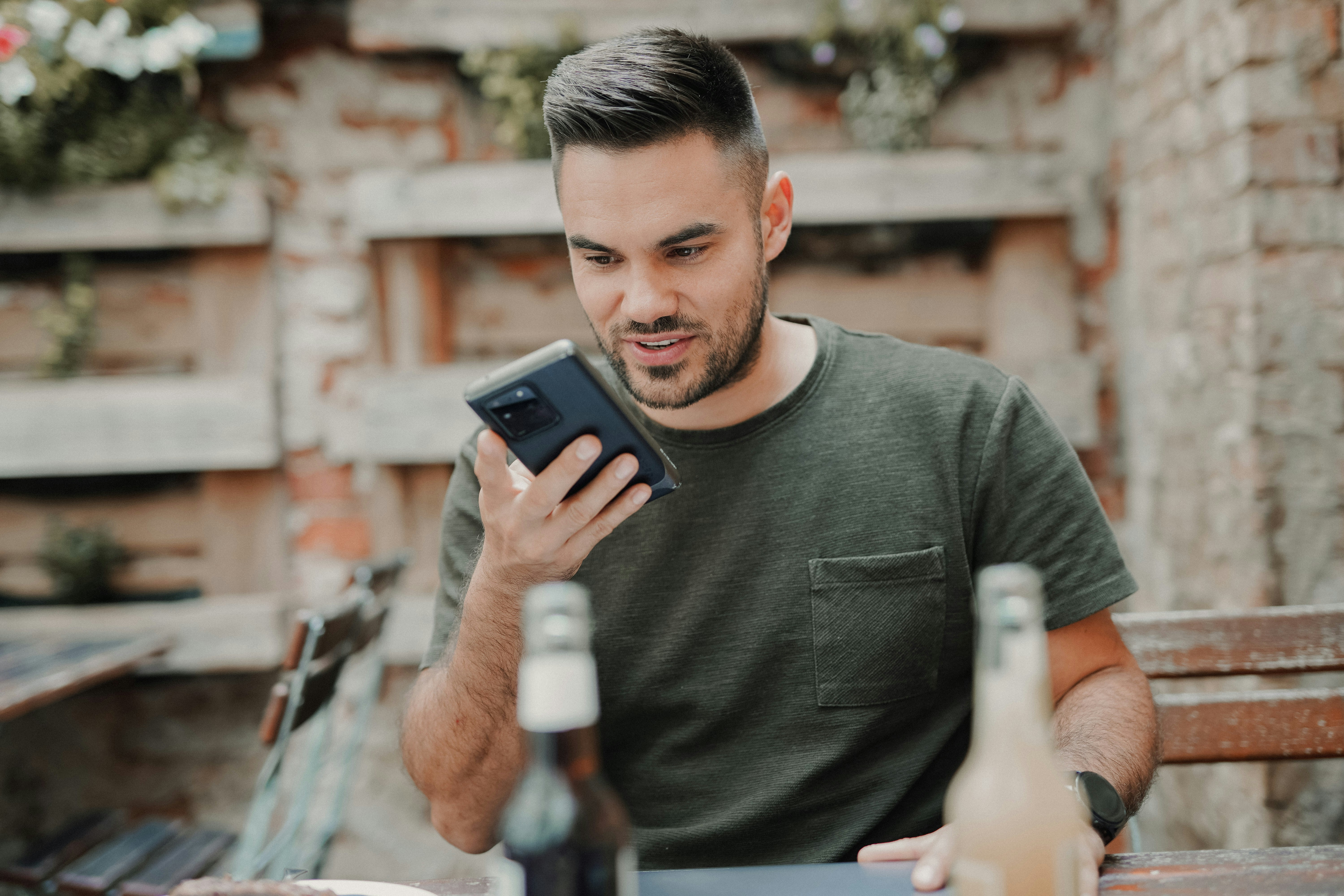 person using  mobile app for AI voice generator