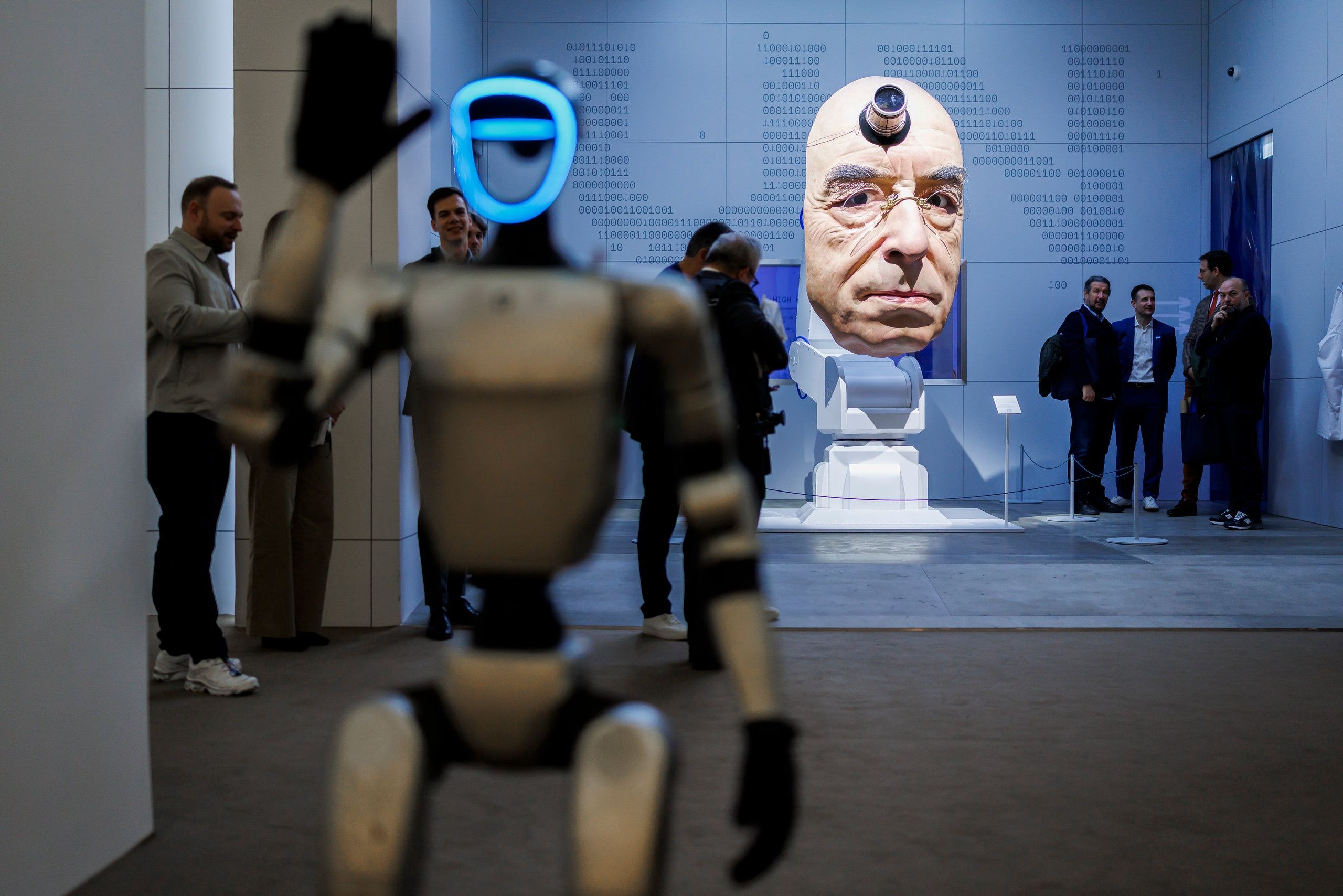 Ulysse Nardin booth featuring humanoid robot and large sculpted head installation at Watches And Wonders