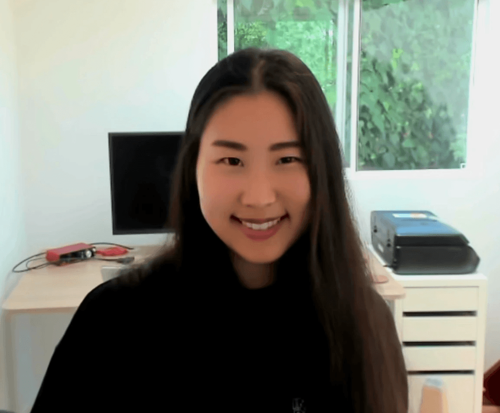 photo of woman wearing black smiling