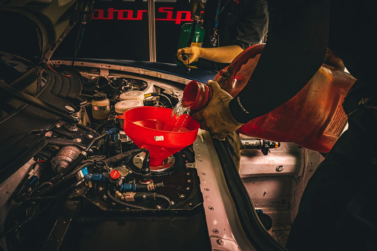 HyperAuto Care Engine Bay Detailing service in a professional auto care workshop