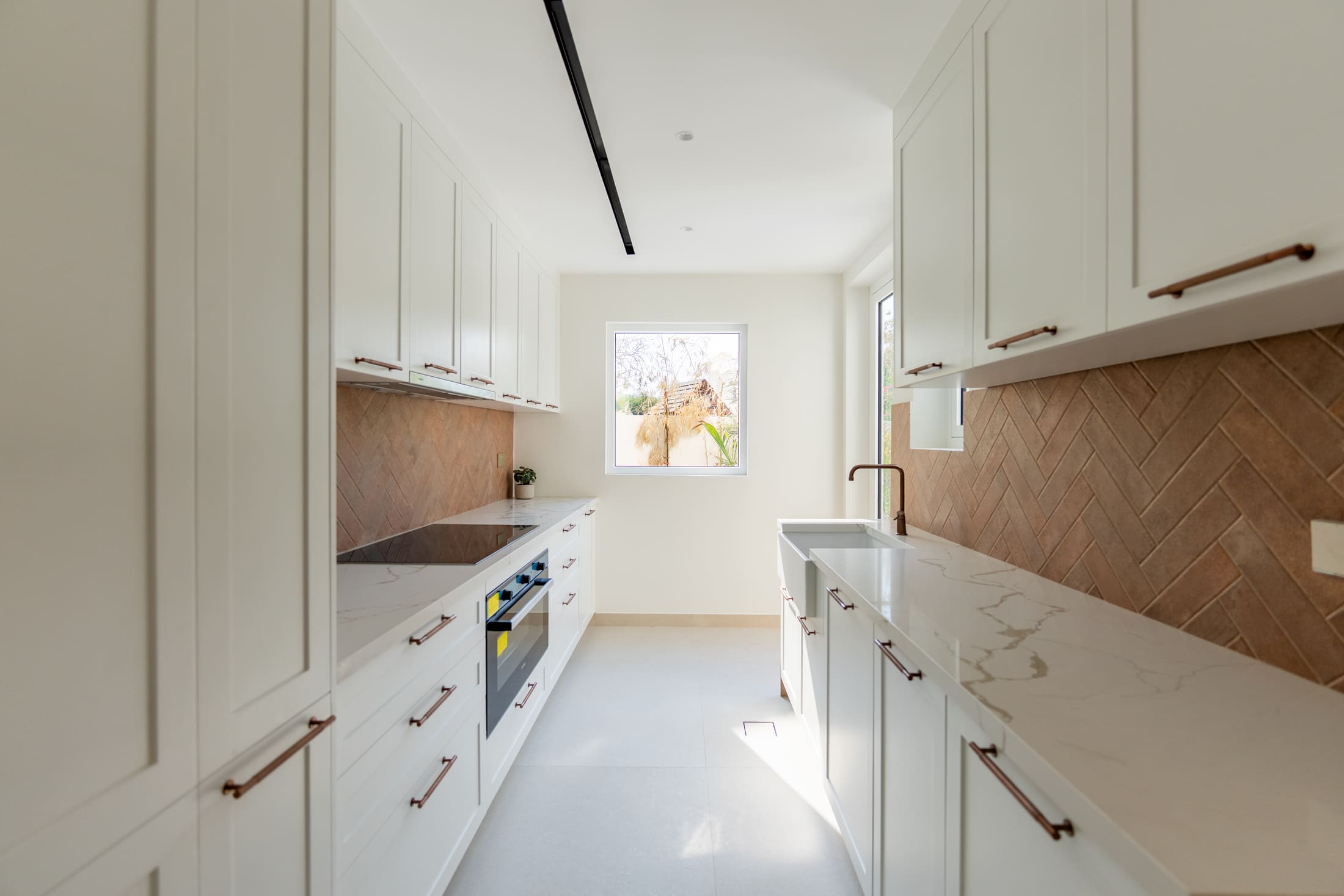 Picture of a kitchen with a glass window 