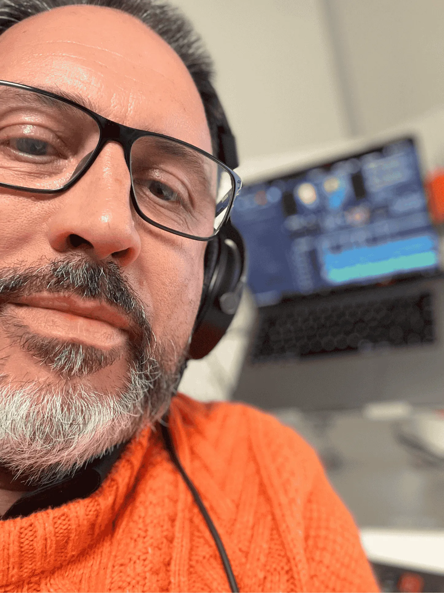 Young black woman witting at the table working on a laptop