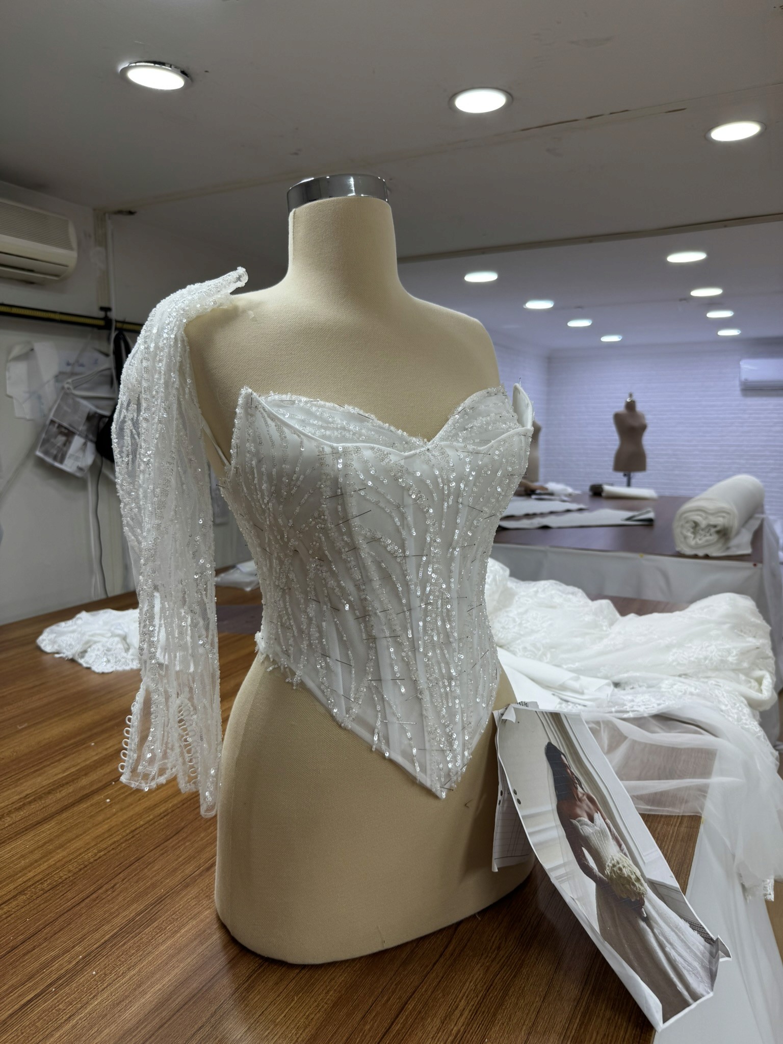 Lucidbride atelier update showing structured corsetry on a custom bridal gown.