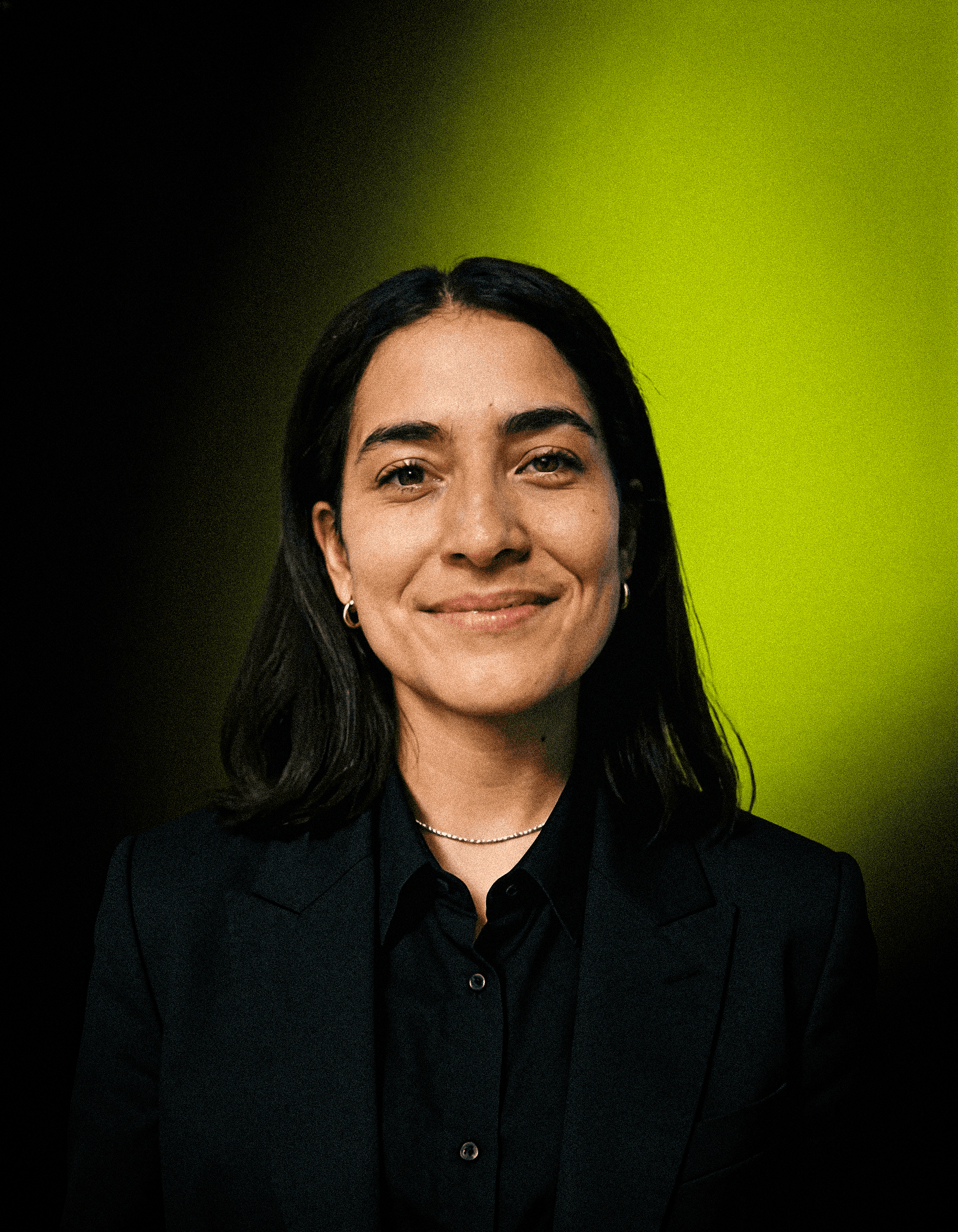 headshot of male in dark background