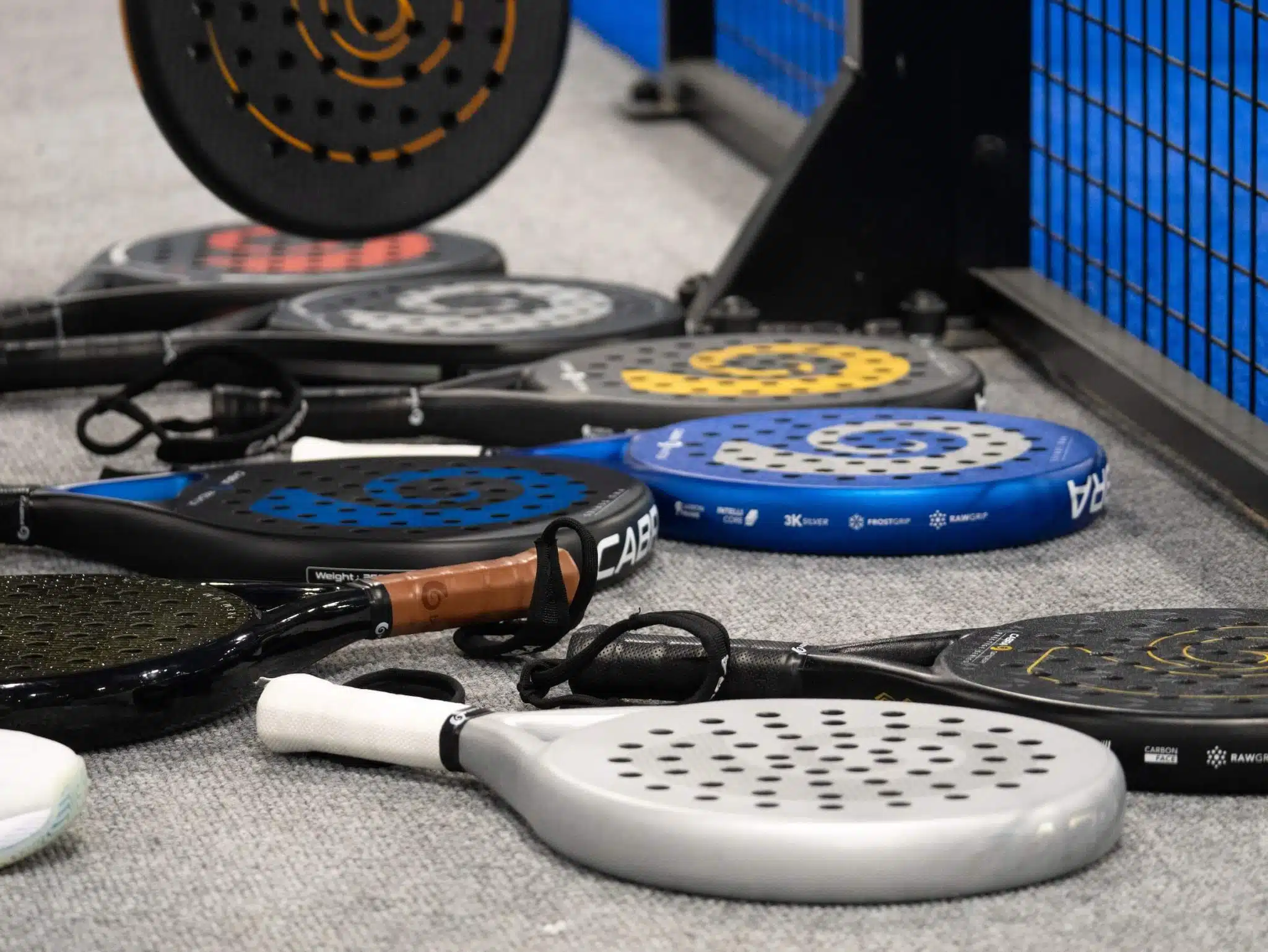 Selection of padel rackets on the ground