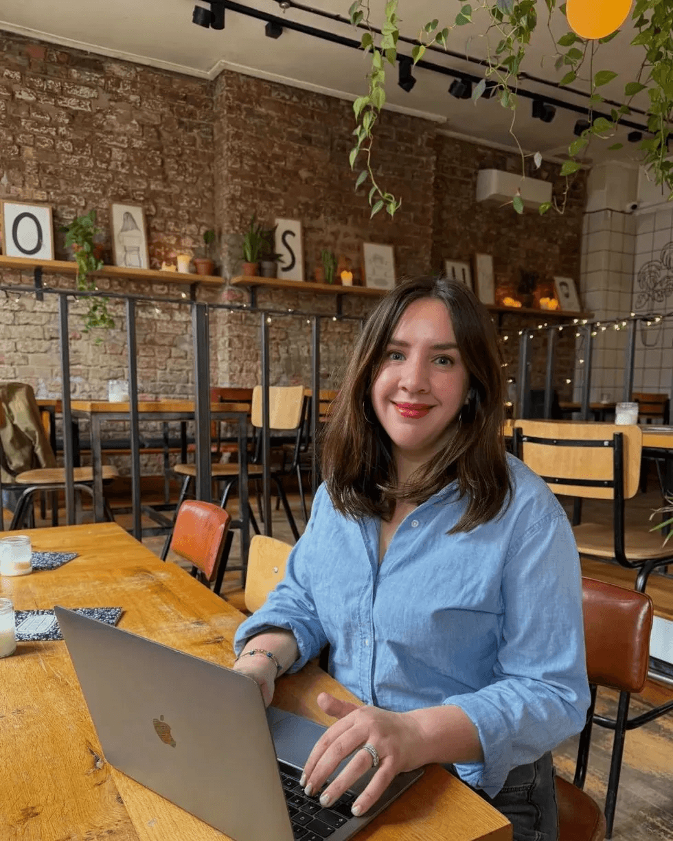 Catherine at laptop in cafe