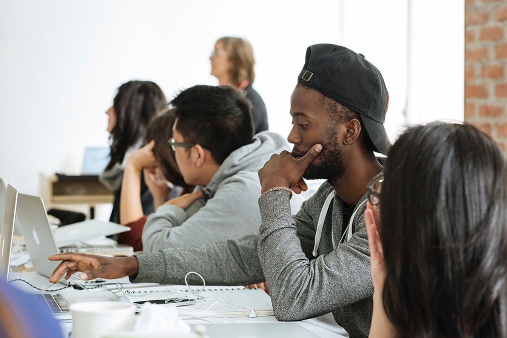 A designer captured in a moment of engaged focus, mid-session and fully present.