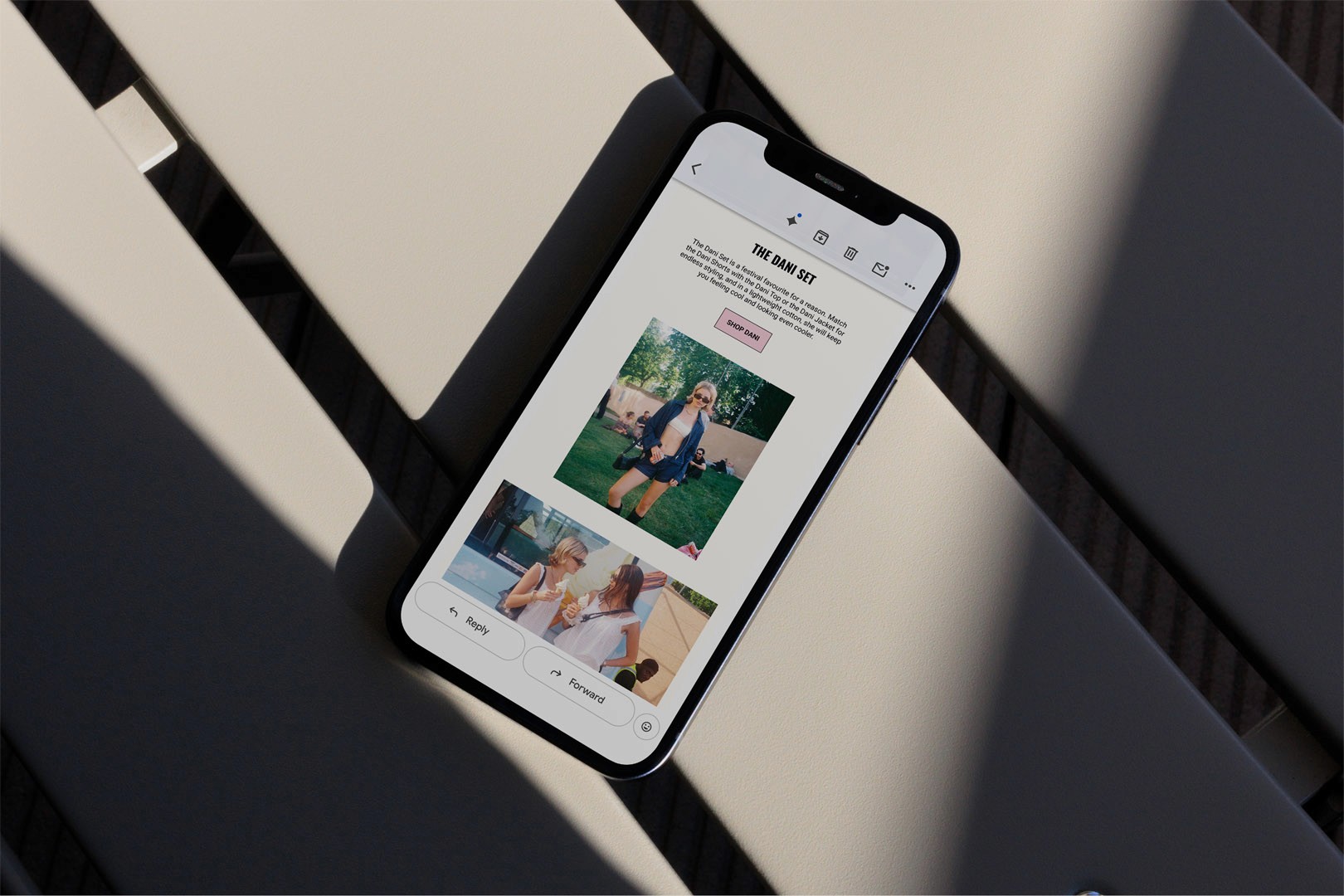 Minka Dink London e-mail newsletter design in a phone