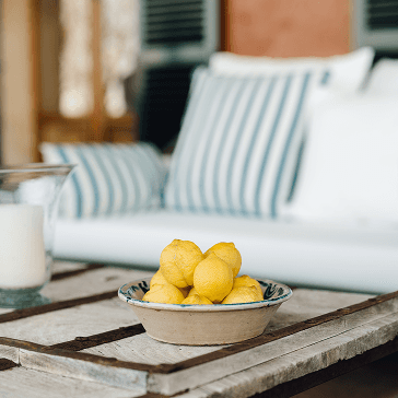 Three dried palm leaf fans on a wall