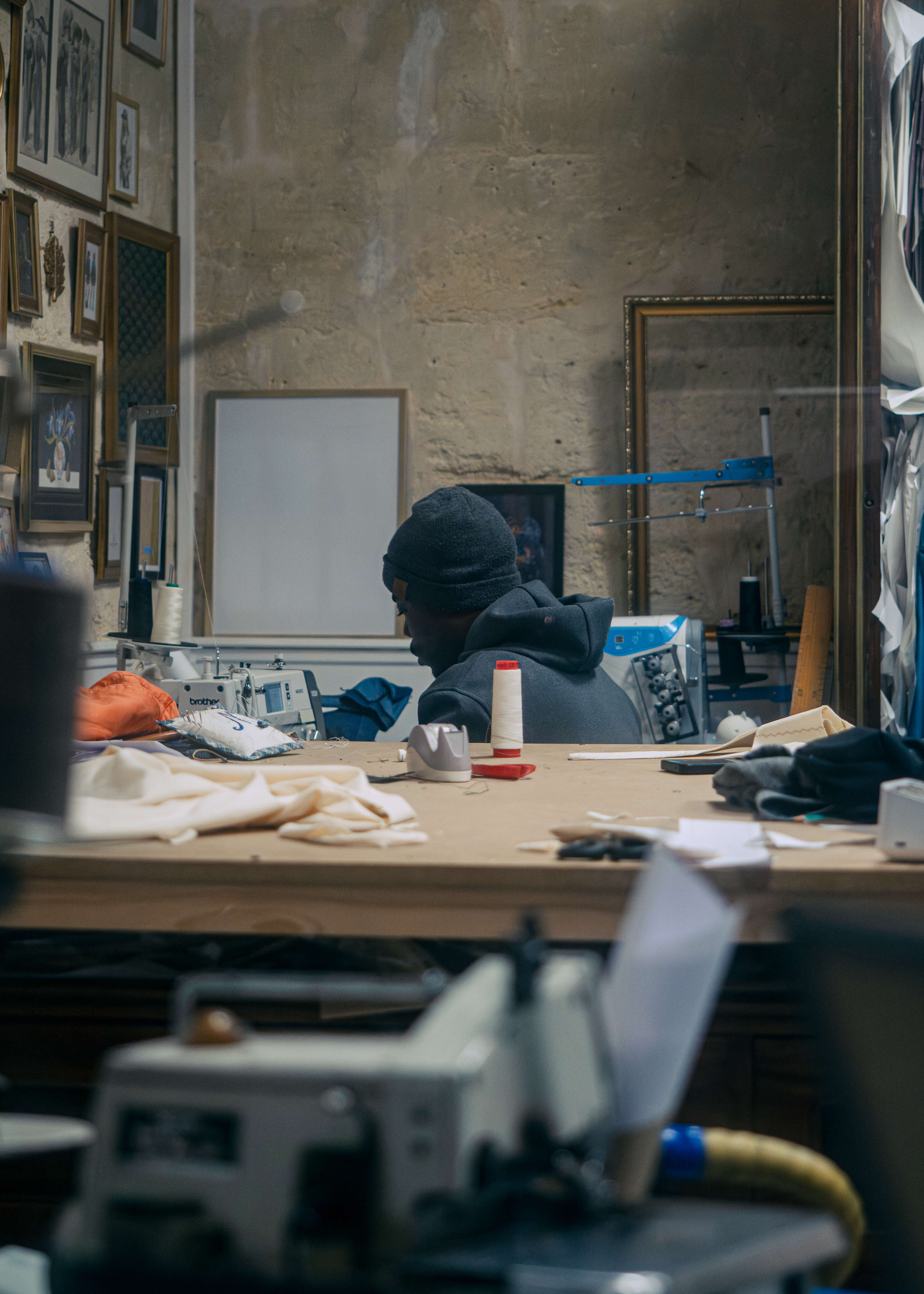 Tree branches reach towards a clear, blue sky.