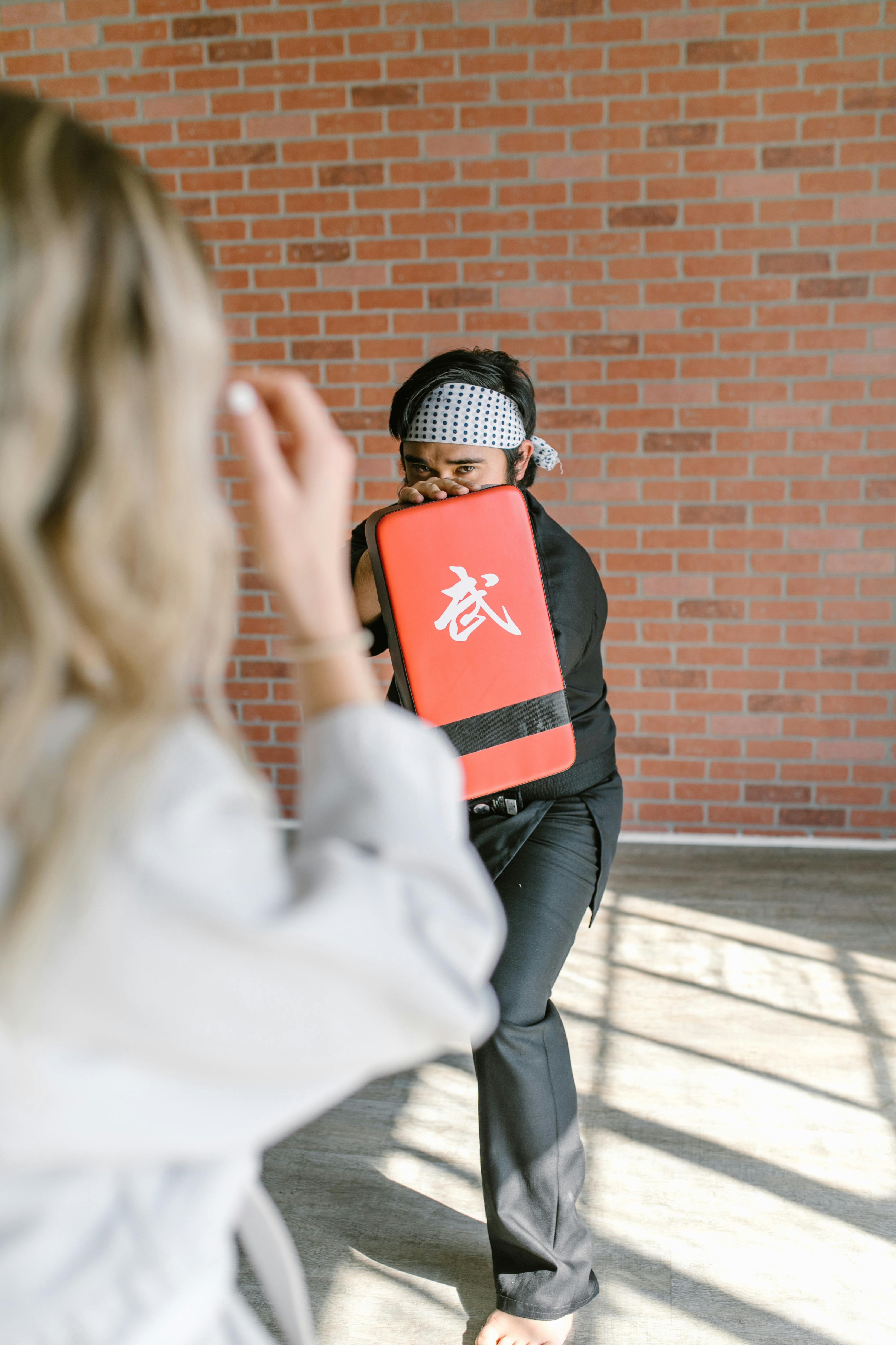 martial-arts-training-with-focus-pad-in-a-brick-walled-dojo. - rdne-stock-project (pexels)