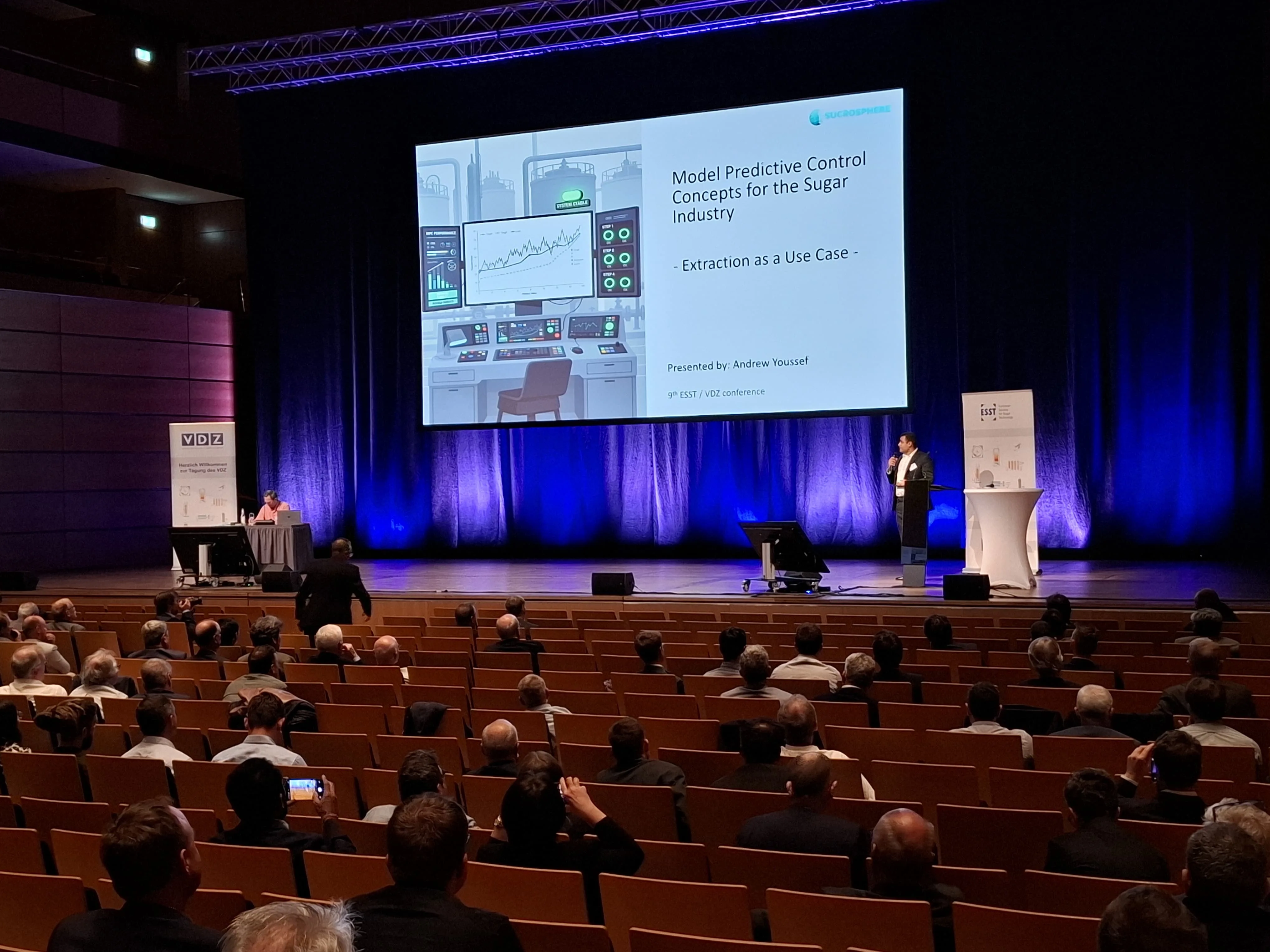 Andrew Youssef presenting MPC extraction control at VDZ/ESST 2026 in Lubeck