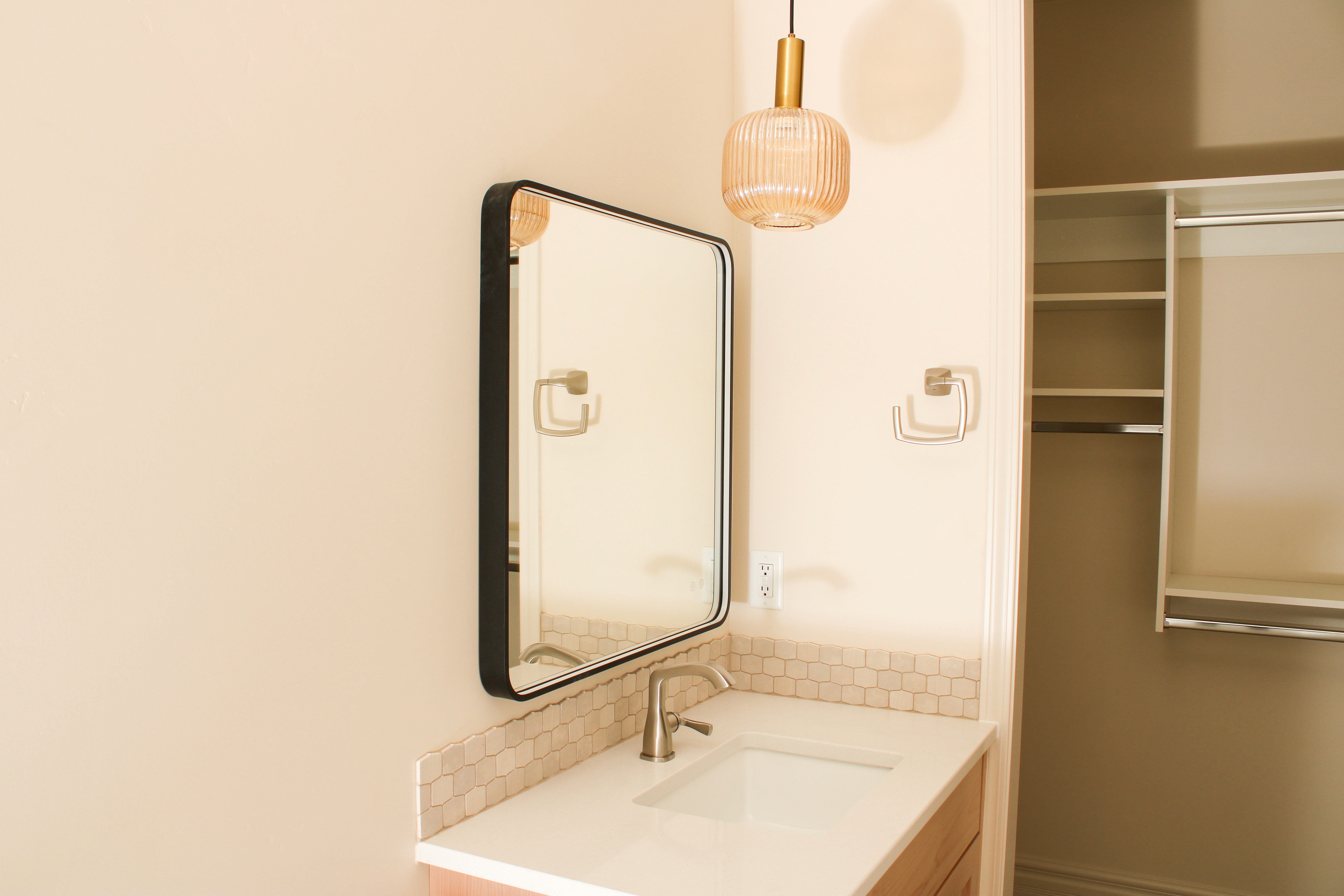 Bathroom vanity with a pendant light fixture in a St. George, Utah home.