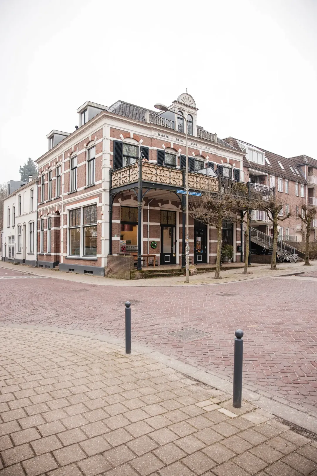 man in green and black plaid long sleeve shirt holding red and black cordless hand drill