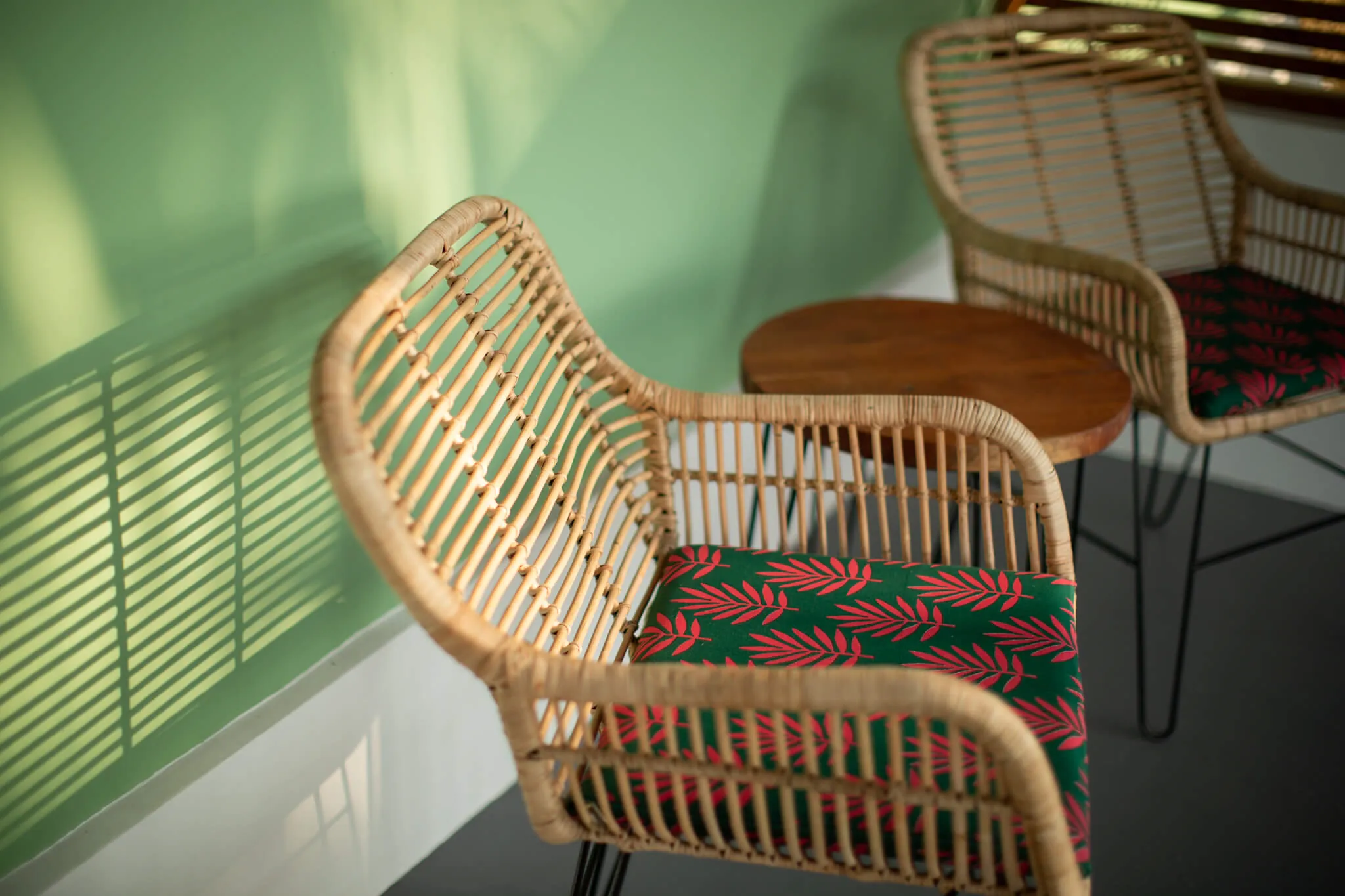 Rattan chairs in soft shutter light at Casa Jaali