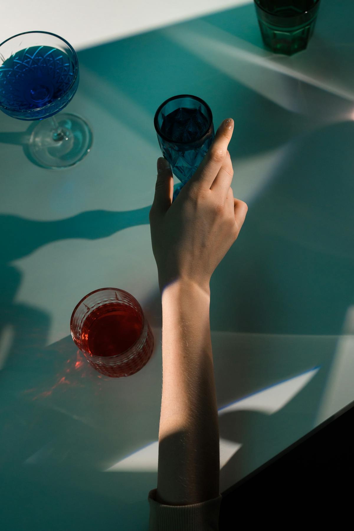 Hand holding a green glass