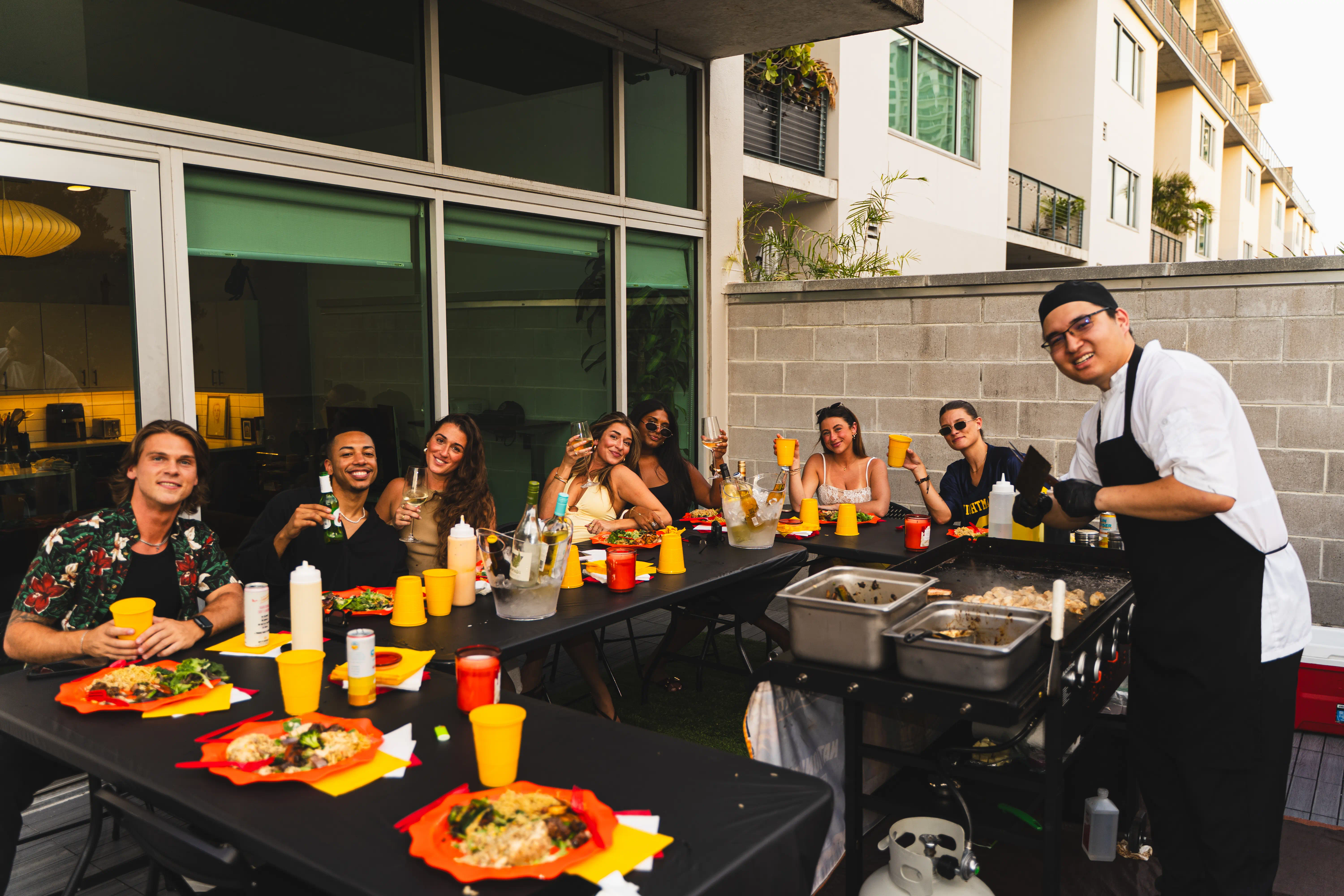Guests seated around a private Hibachi Guru chef at an at-home hibachi dinner