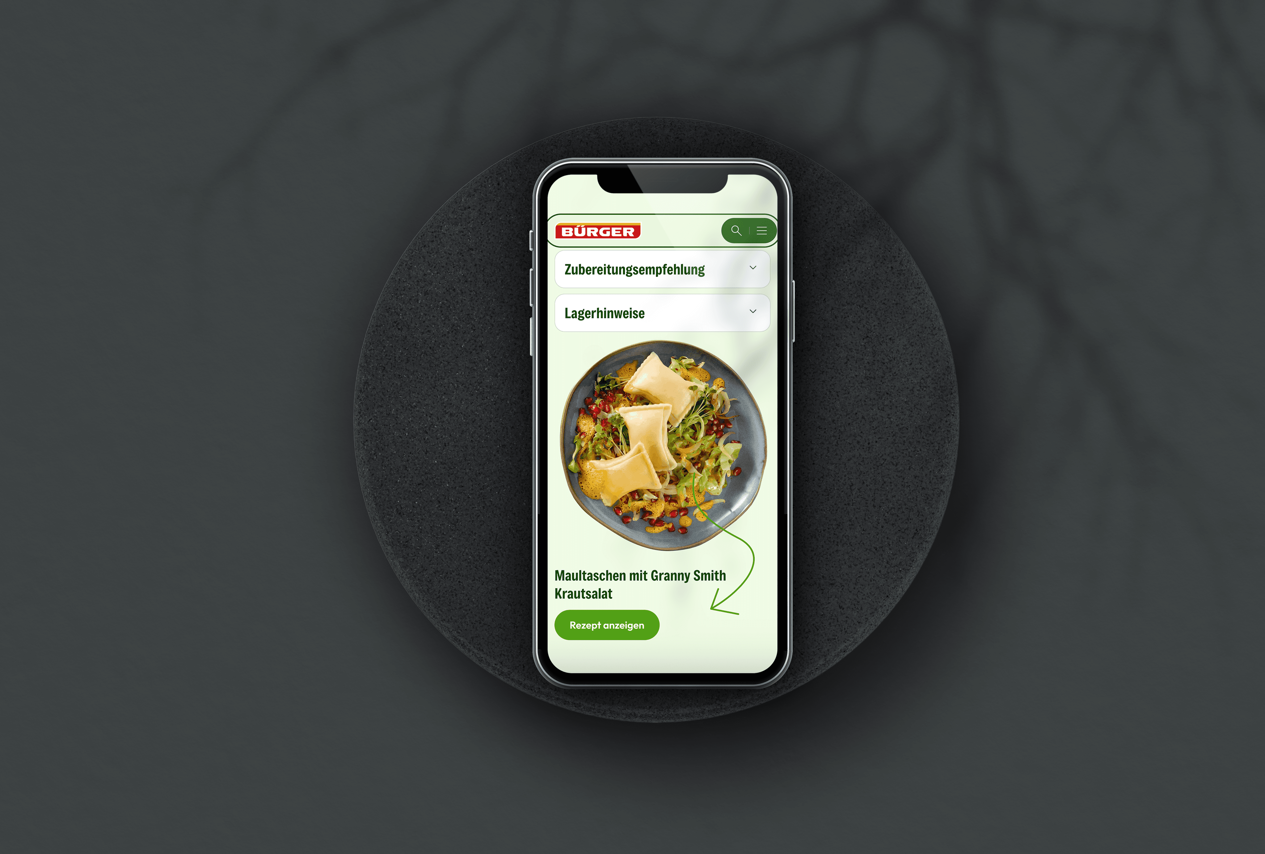 Laptop mockup on a dark background displaying a hero image of a colorful pasta dish on a bright recipe website, used to showcase a responsive web design project.