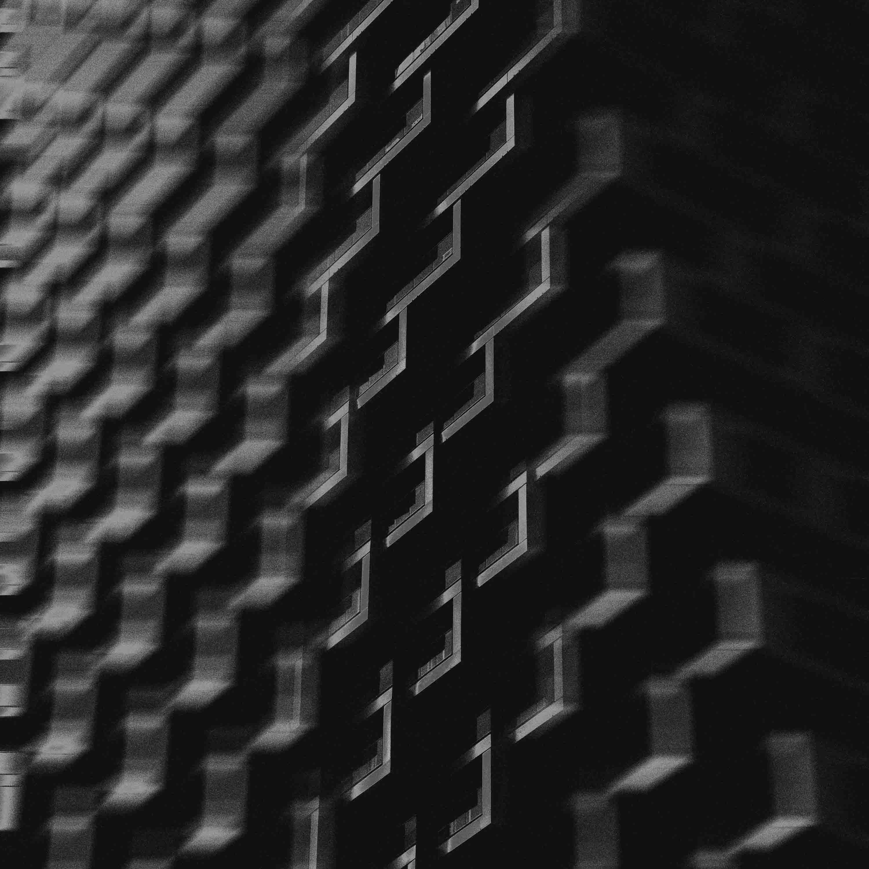 Black and white glass building (photo by Ryunosuke Kikuno via Unsplash)