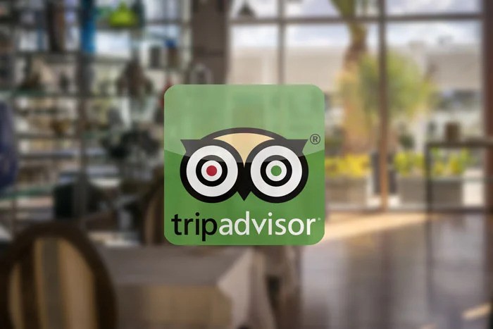 tripadvisor logo on restaurant window