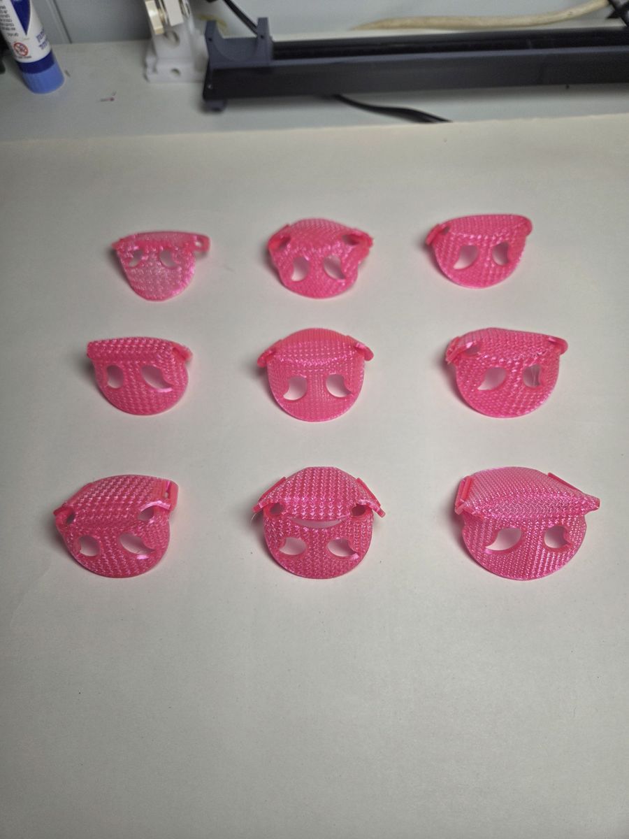 Nine pink Care prototypes laid out in a grid