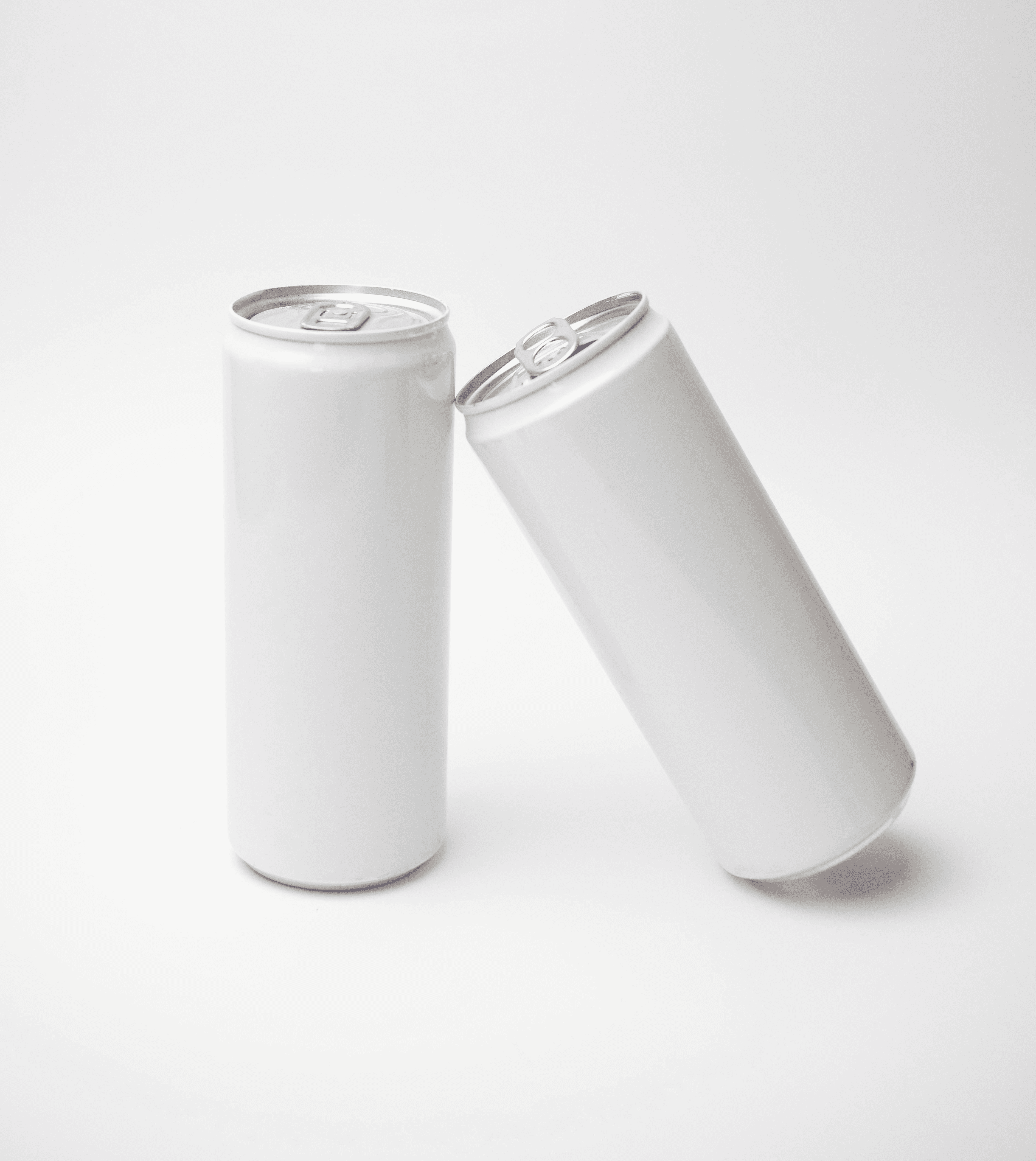 a man holding a cup of coffee and some snacks