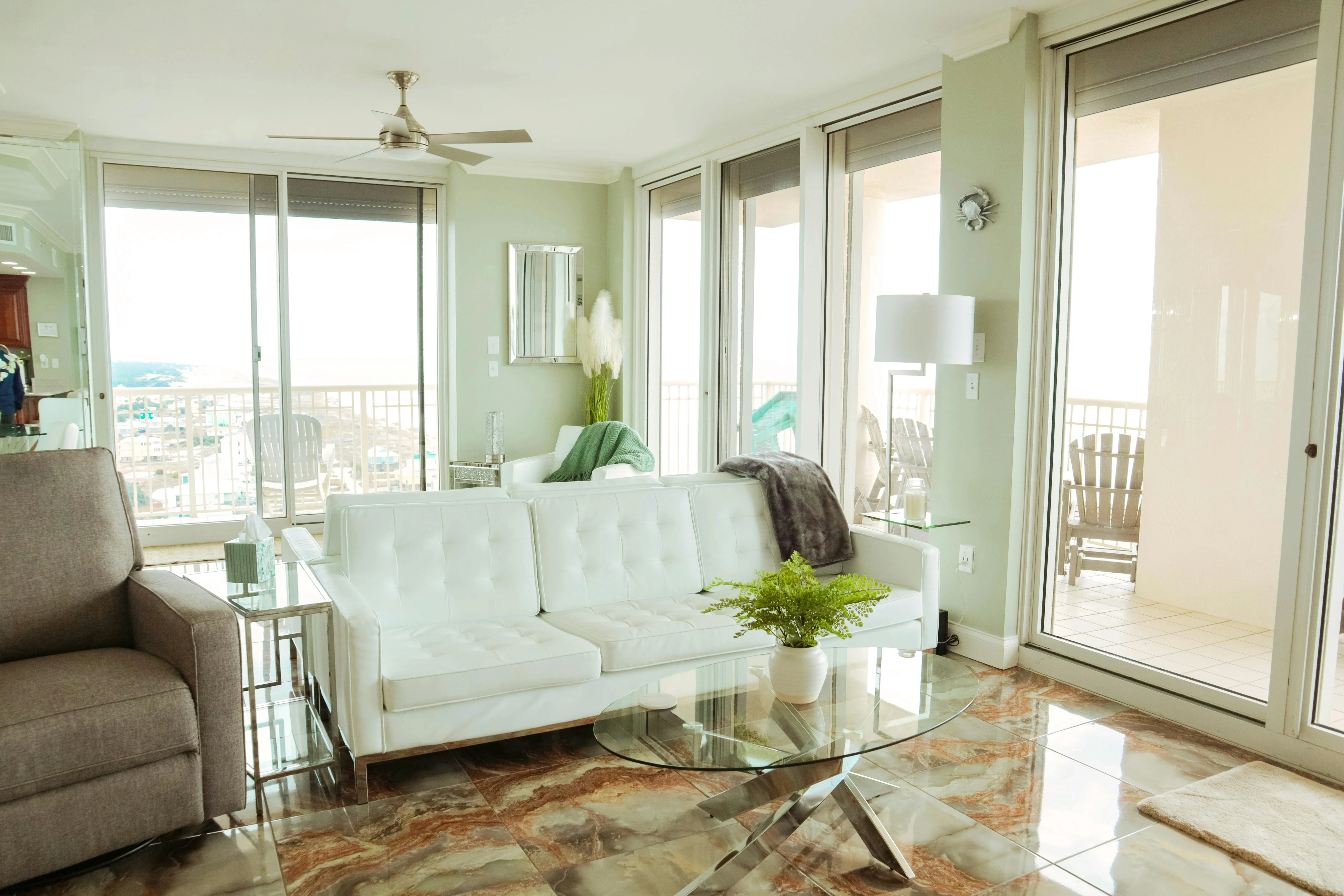 High-end salon interior with modern styling chairs, large mirrors, and glass partitions.