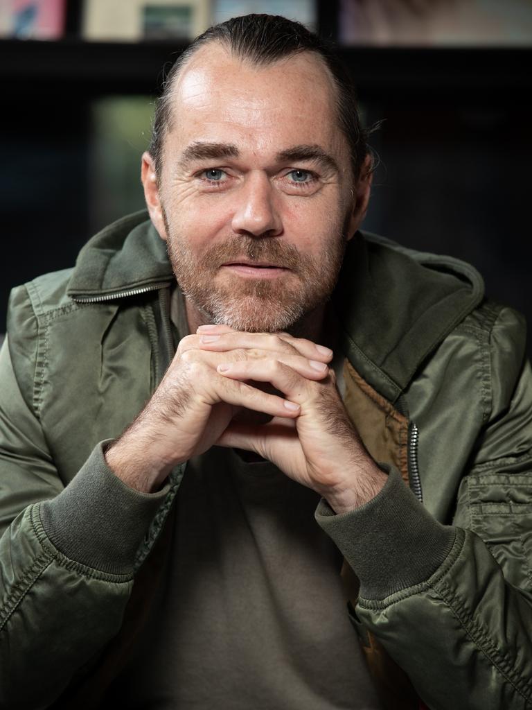 man in black hoodie standing