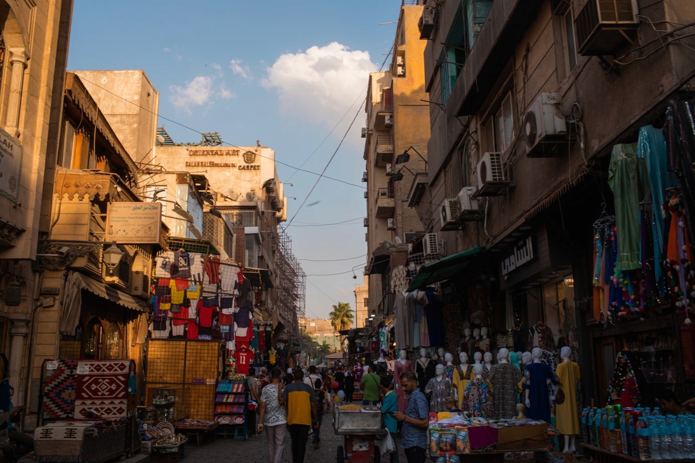 A busy market street in central Cairo in late-afternoon light