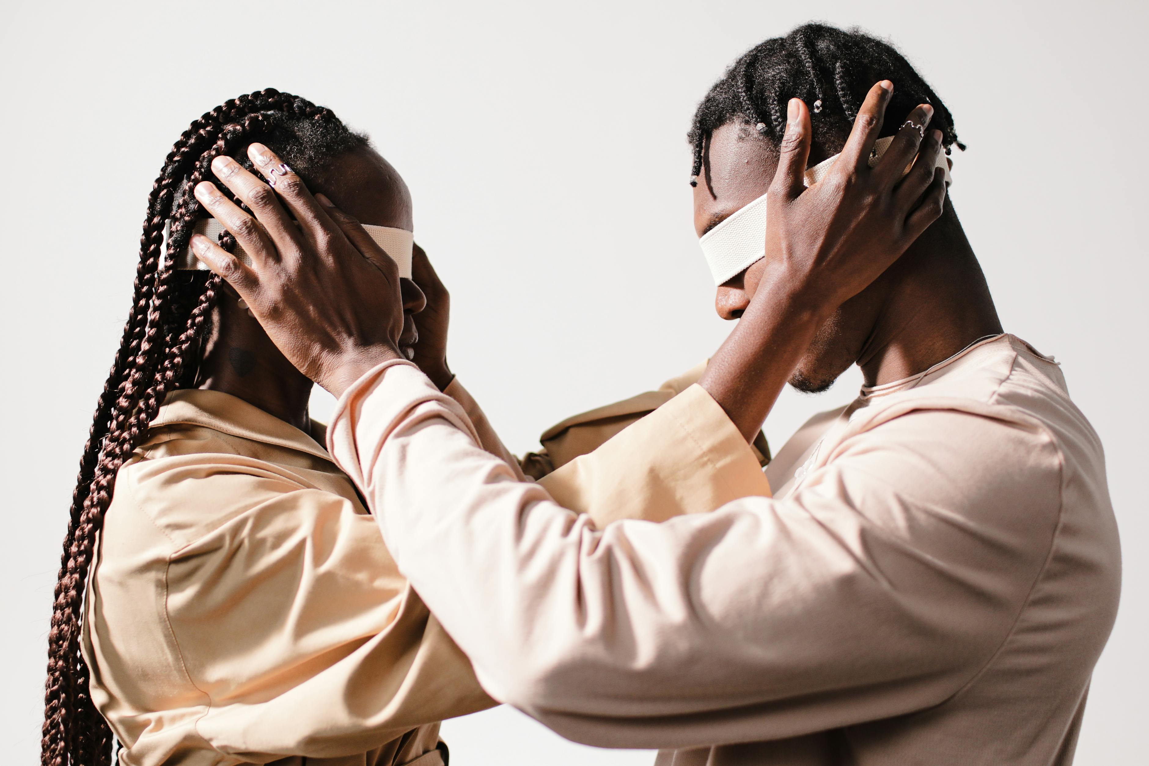 Couple holding each other head