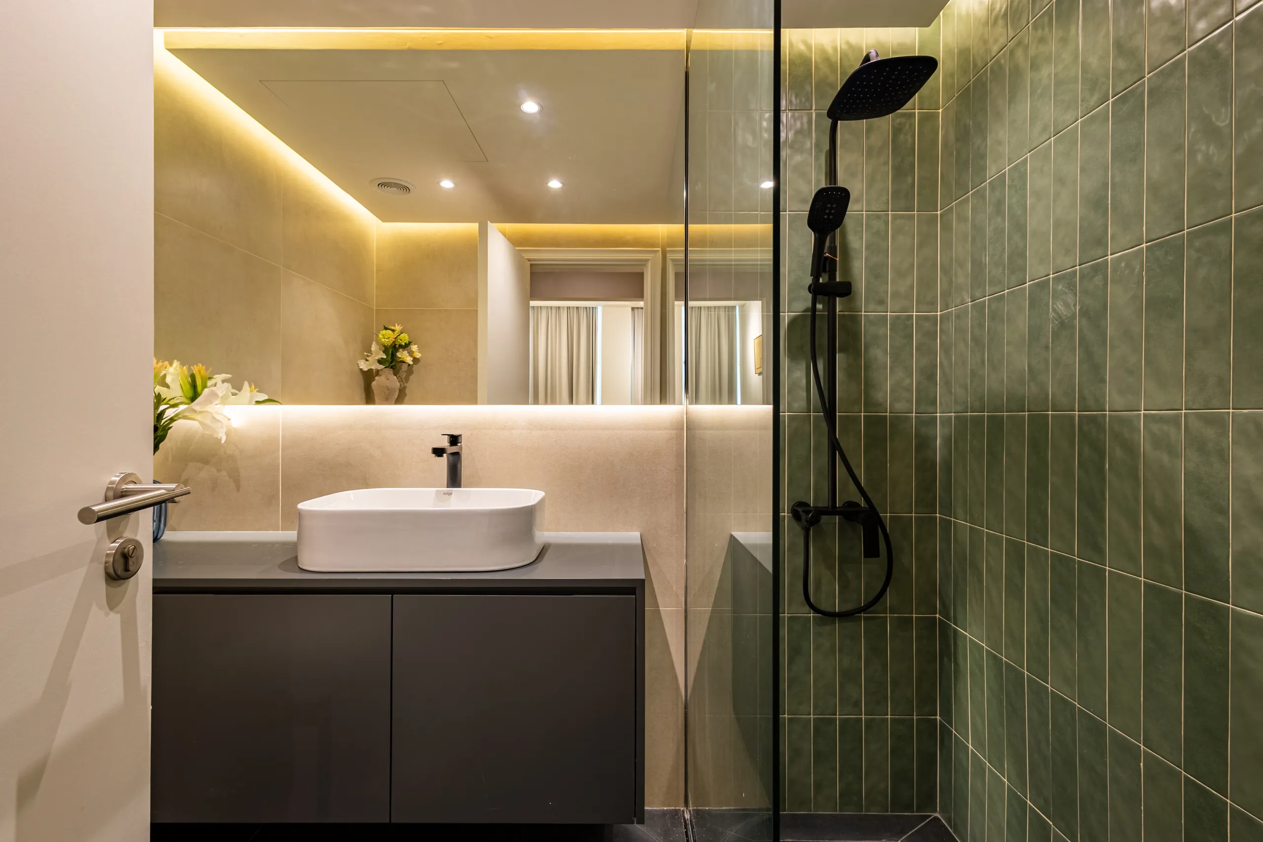 Horizontal detail of a shower in a bathroom.