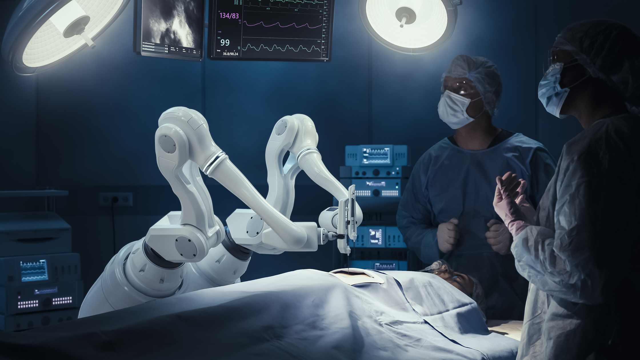 A robotic surgery assistant, assisting two doctors during a surgery.