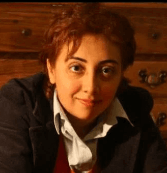 woman smiling wearing denim jacket