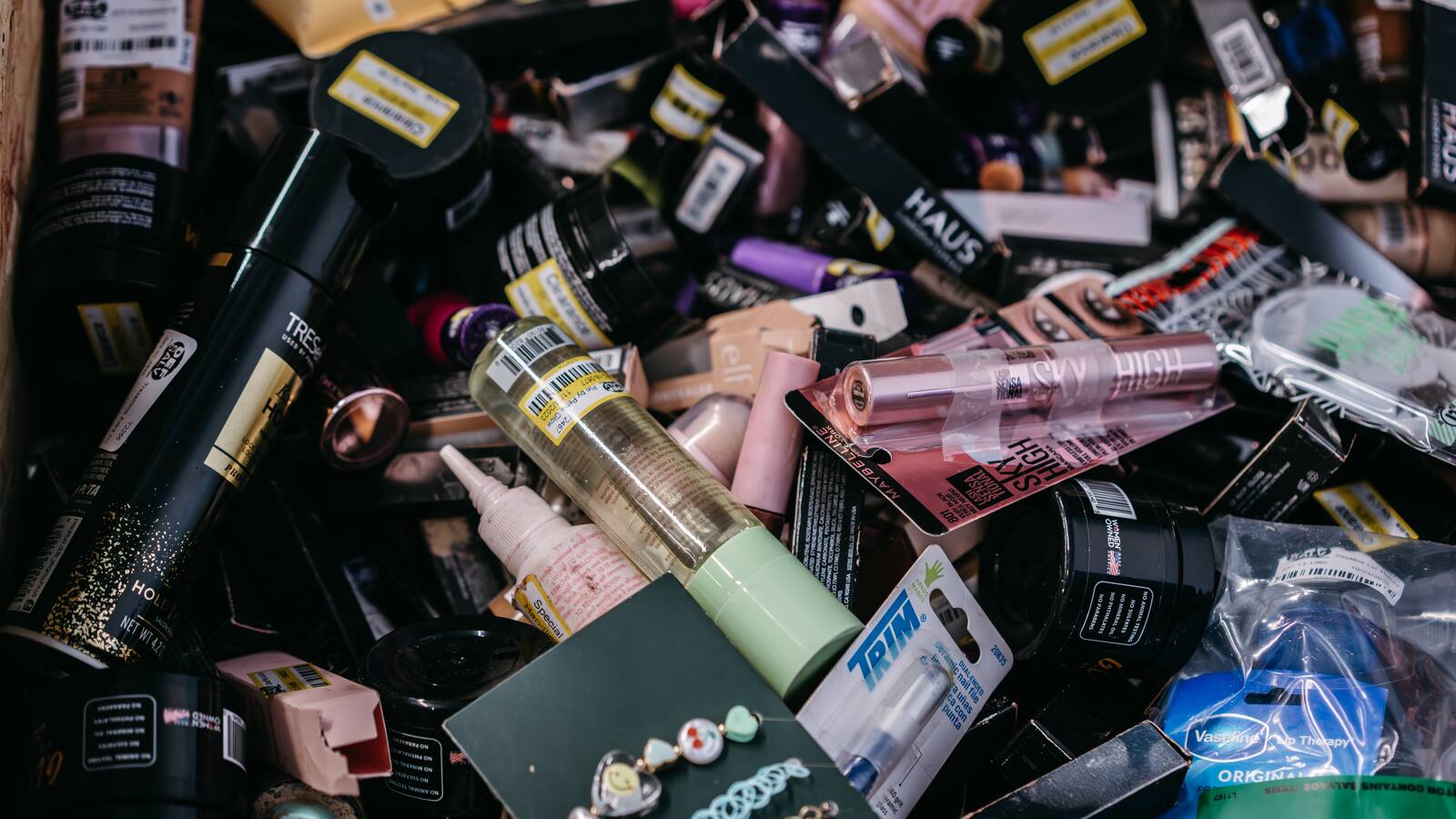 Bags are full of colorful bottle caps.