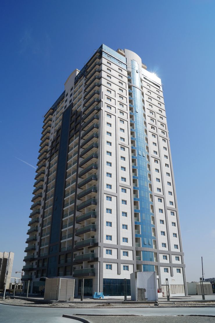 Stunning architectural view of Red Residence apartments, showcased by expert real estate agency services.