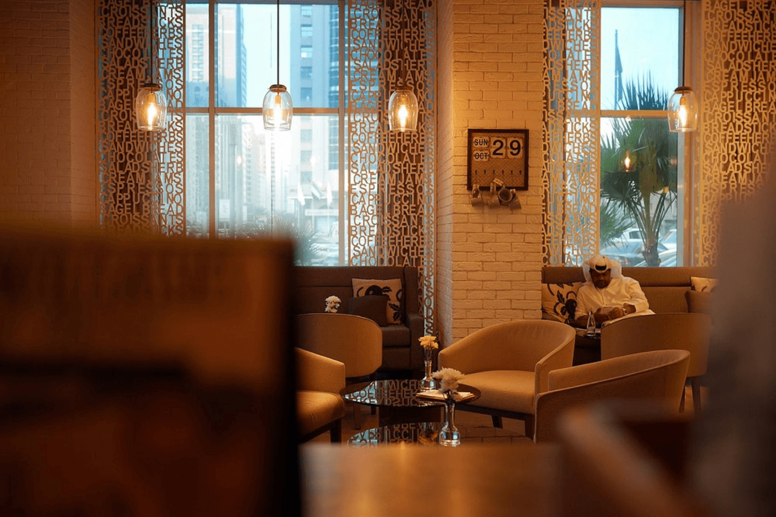 Warm and inviting cafe with soft lighting at Café 302 in Abu Dhabi.