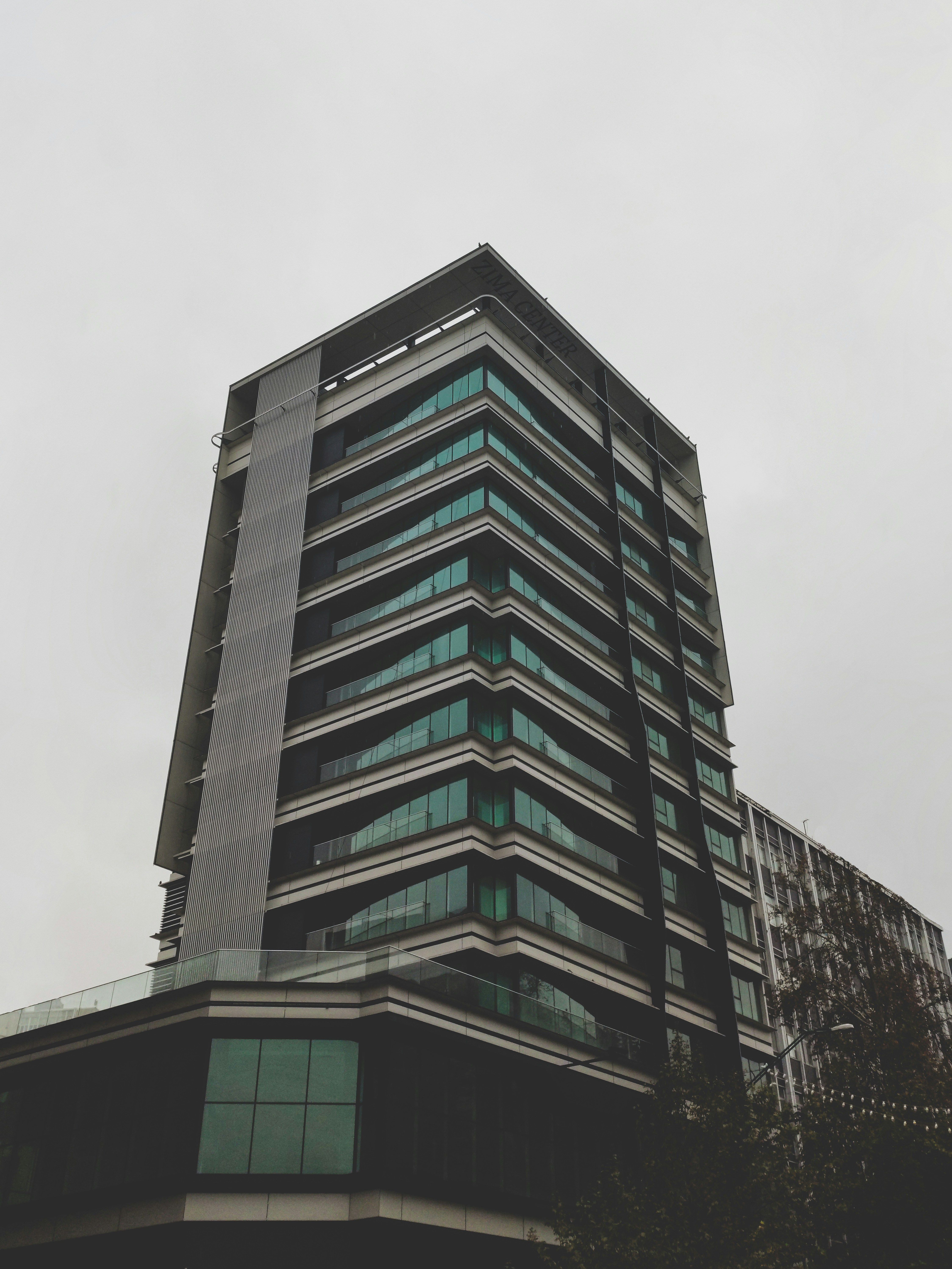 gray concrete building under white sky during daytime