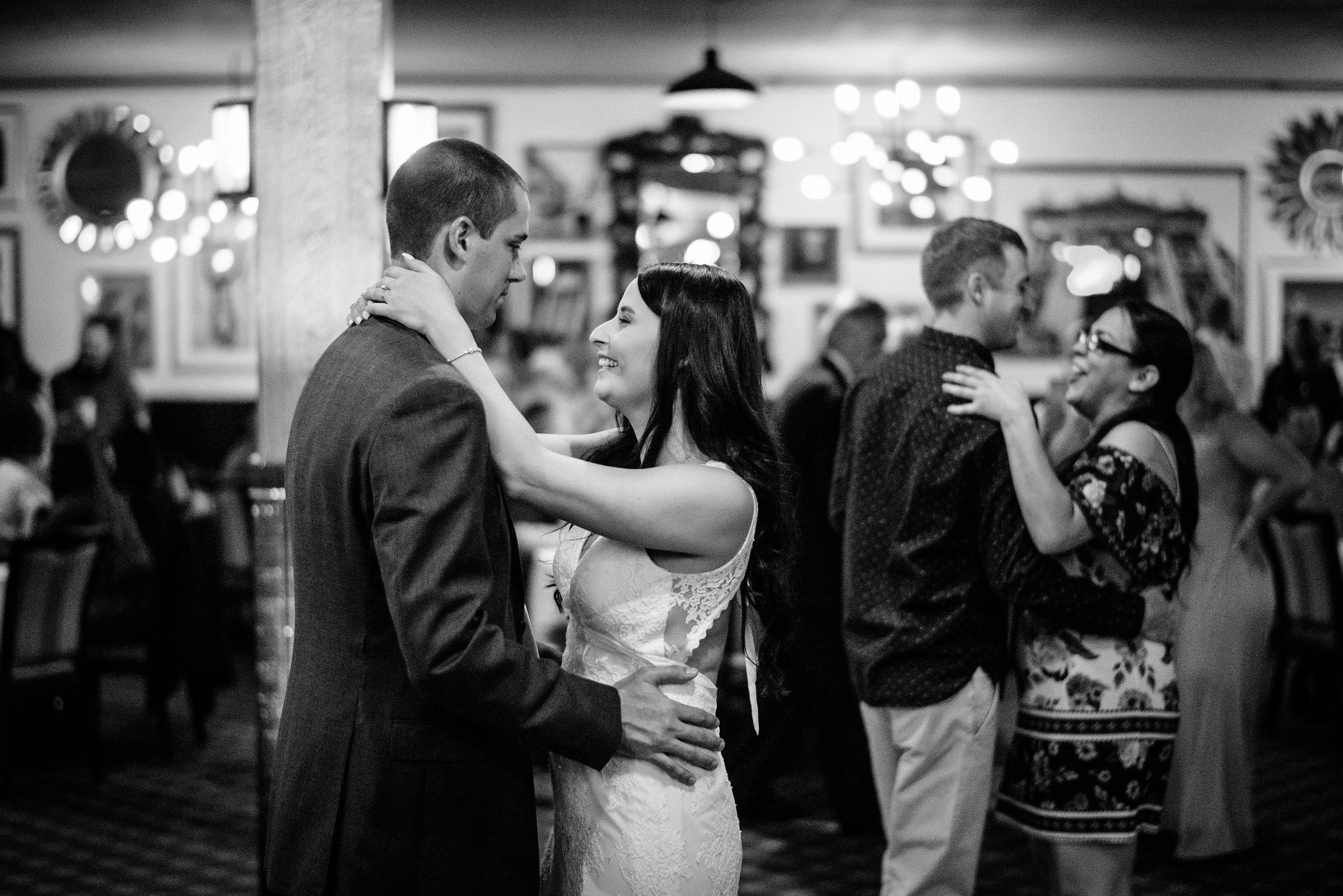 Chef plating a fried chicken sandwich