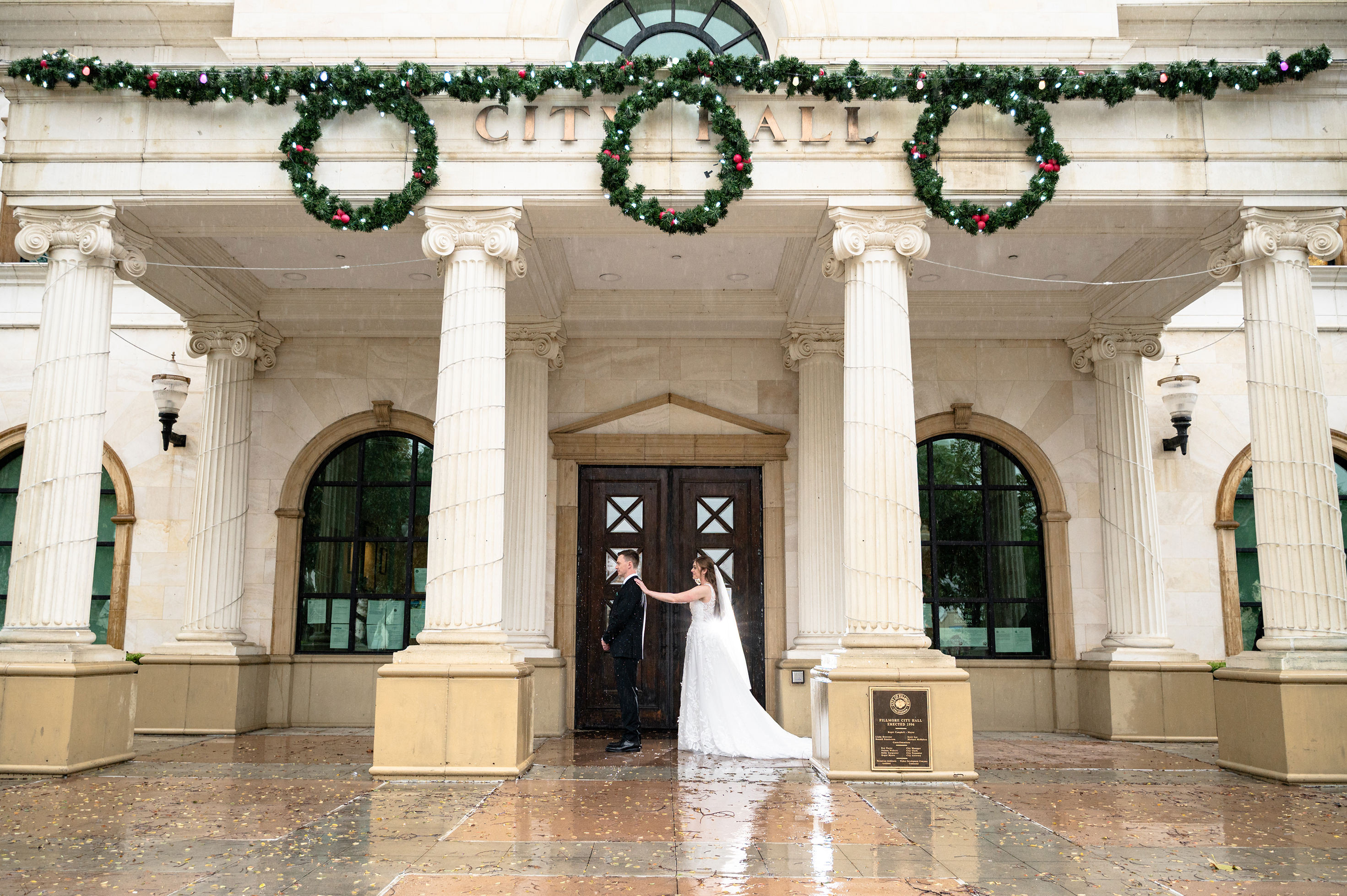 Flat lay wedding details with bouquet, rings, and sparkling bridal heels