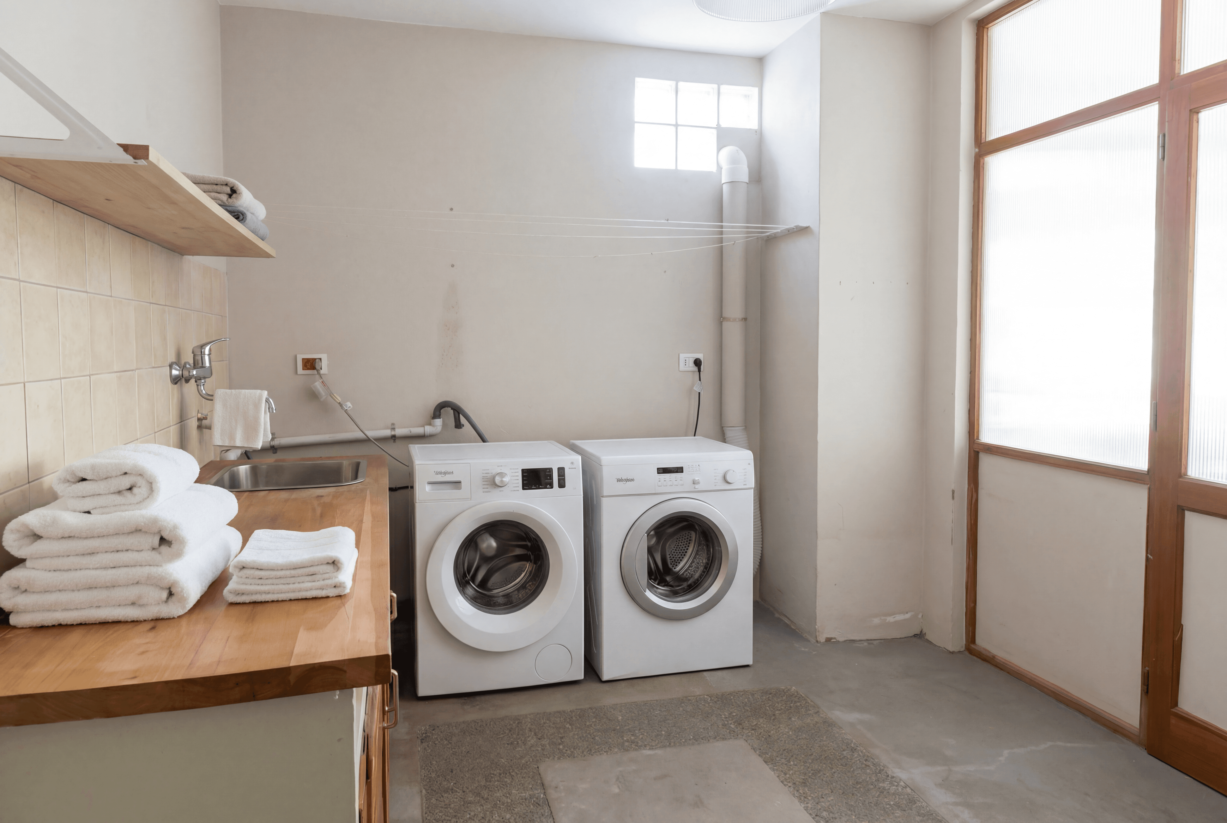 Modern hillside house with stilts and glass railing