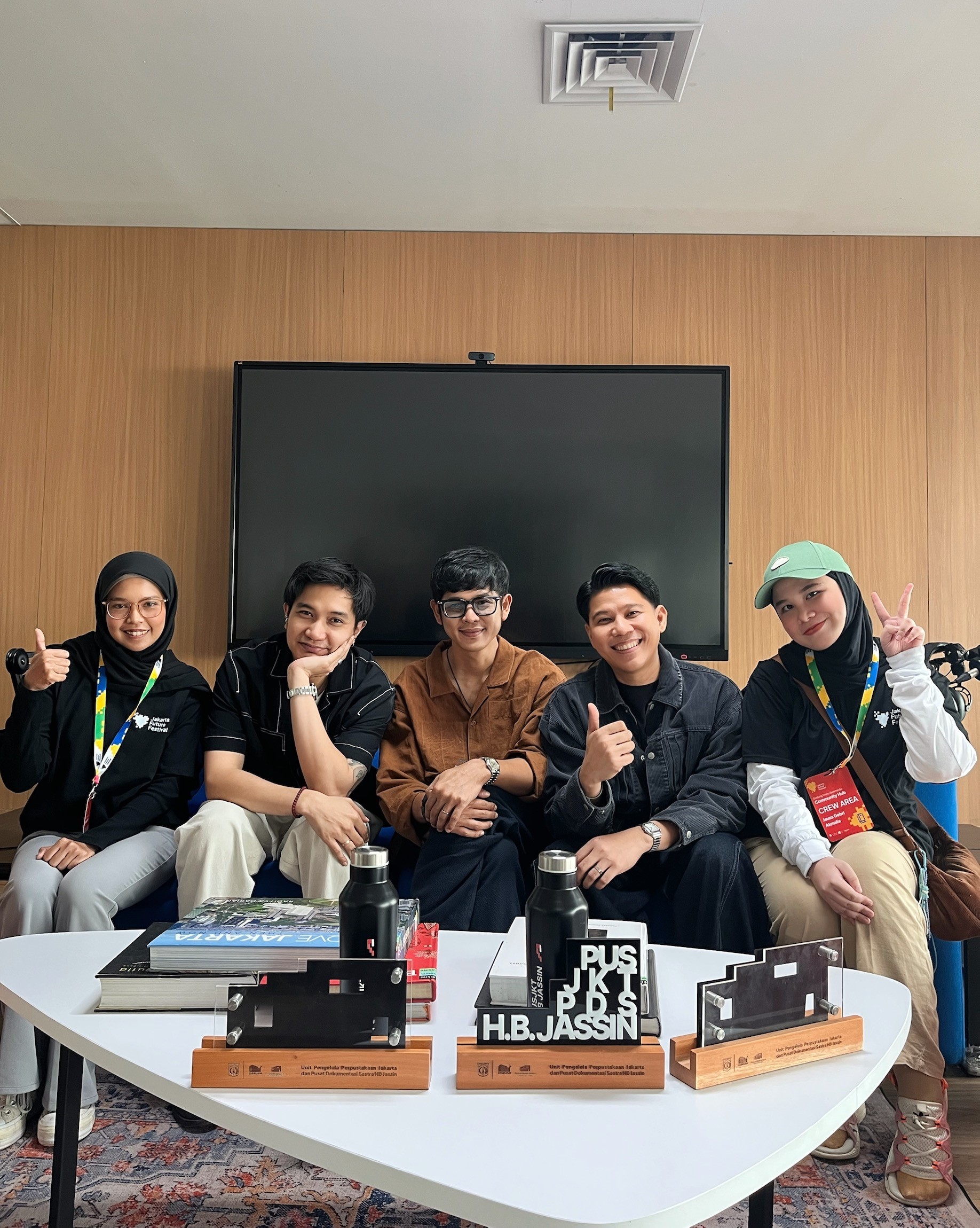 Young woman dancing energetically at a concert.